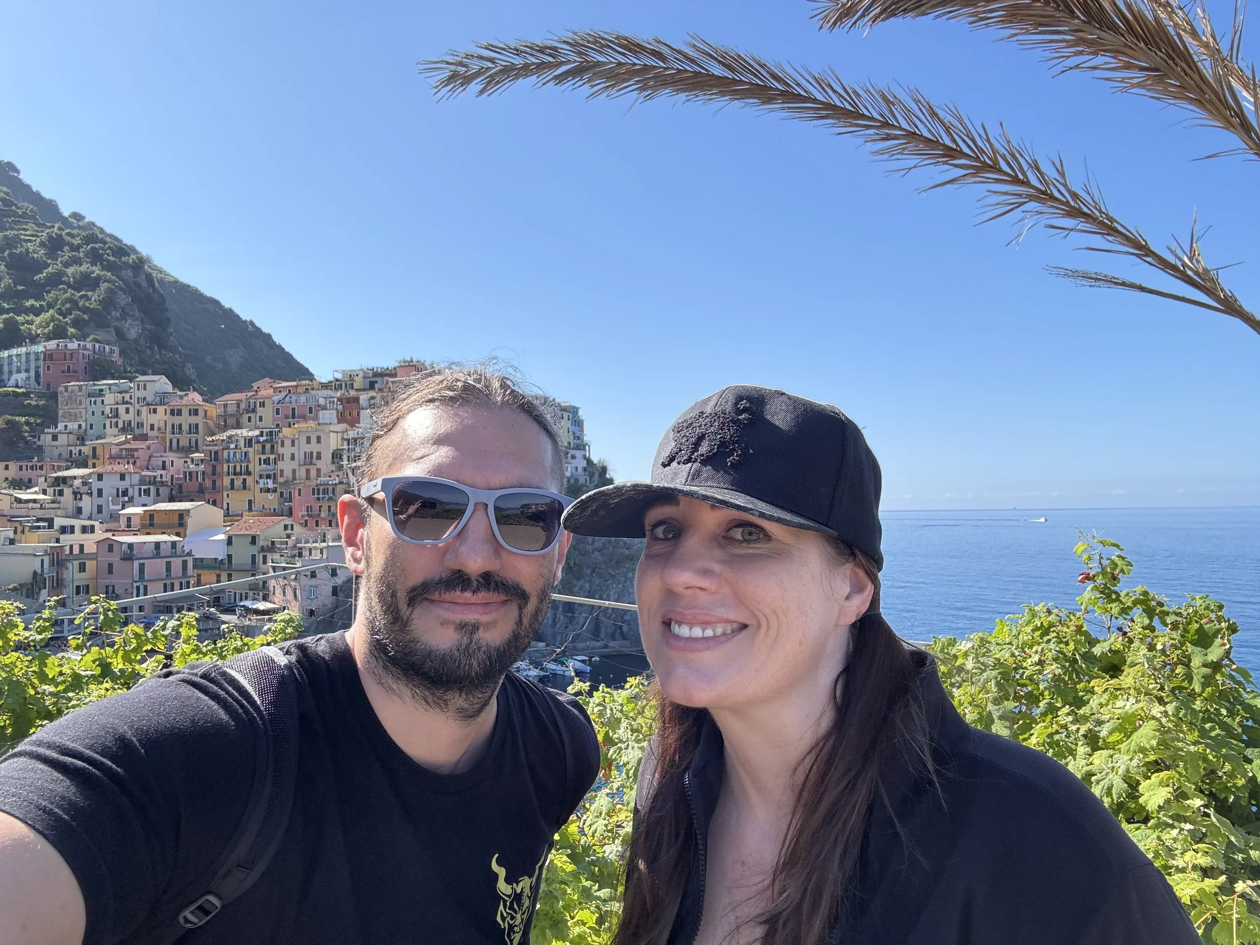 Couple overlooking colorful Manarola