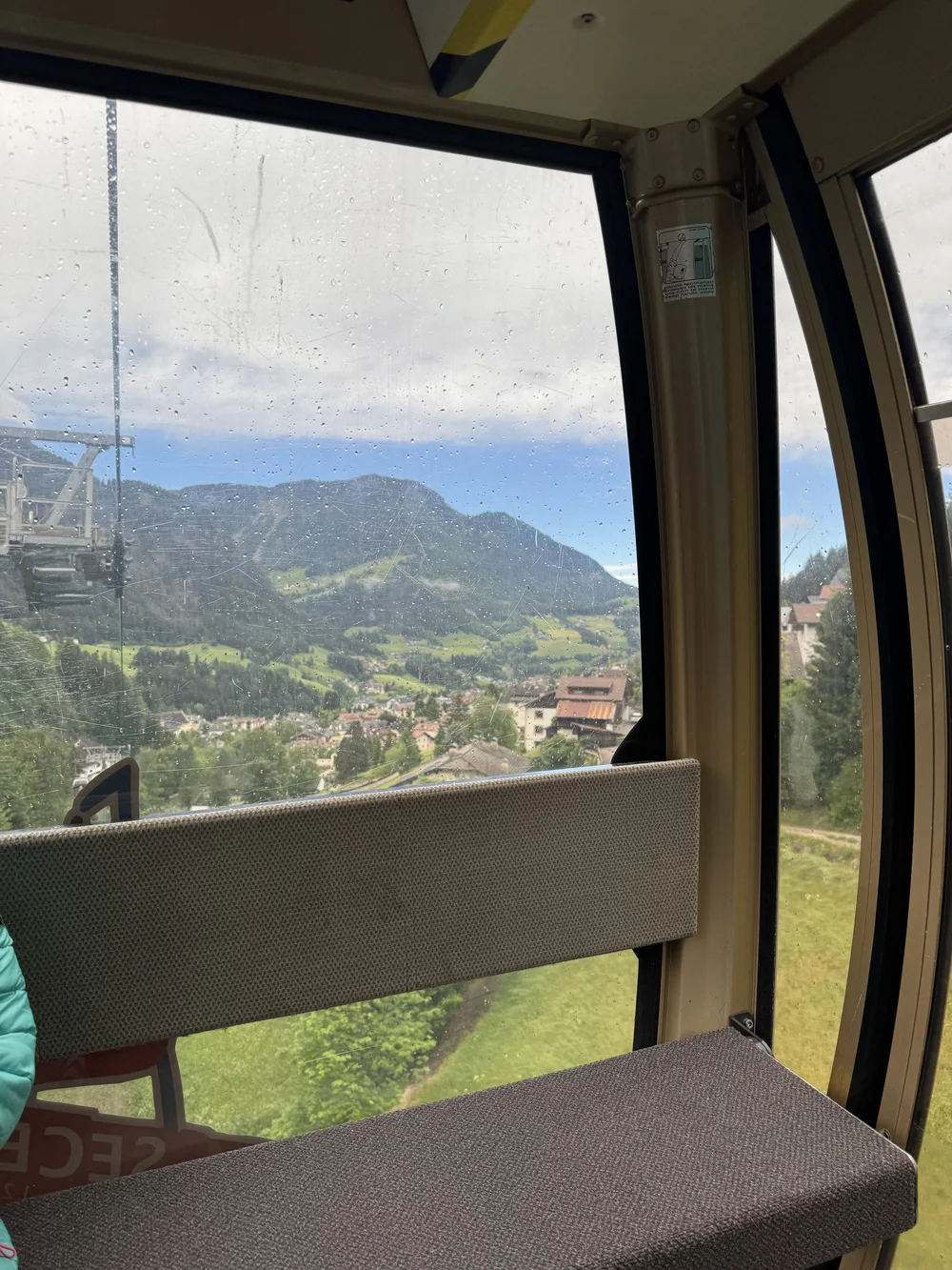 View from the Seceda cable car over Ortisei and the green Val Gardena valley.