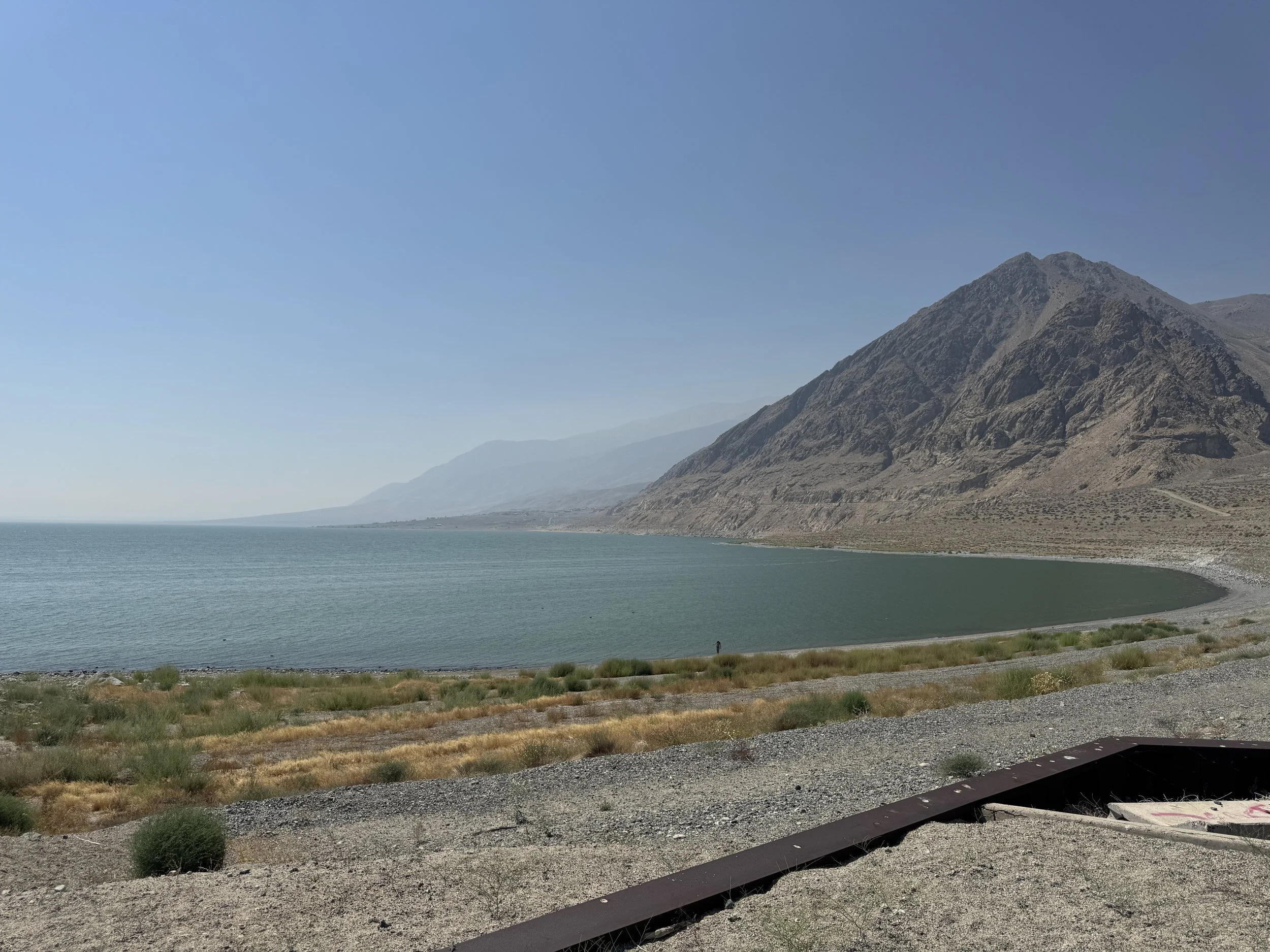 Elevated view of Walker Lake’s blue-green water and rugged desert shoreline beneath Nevada mountains.