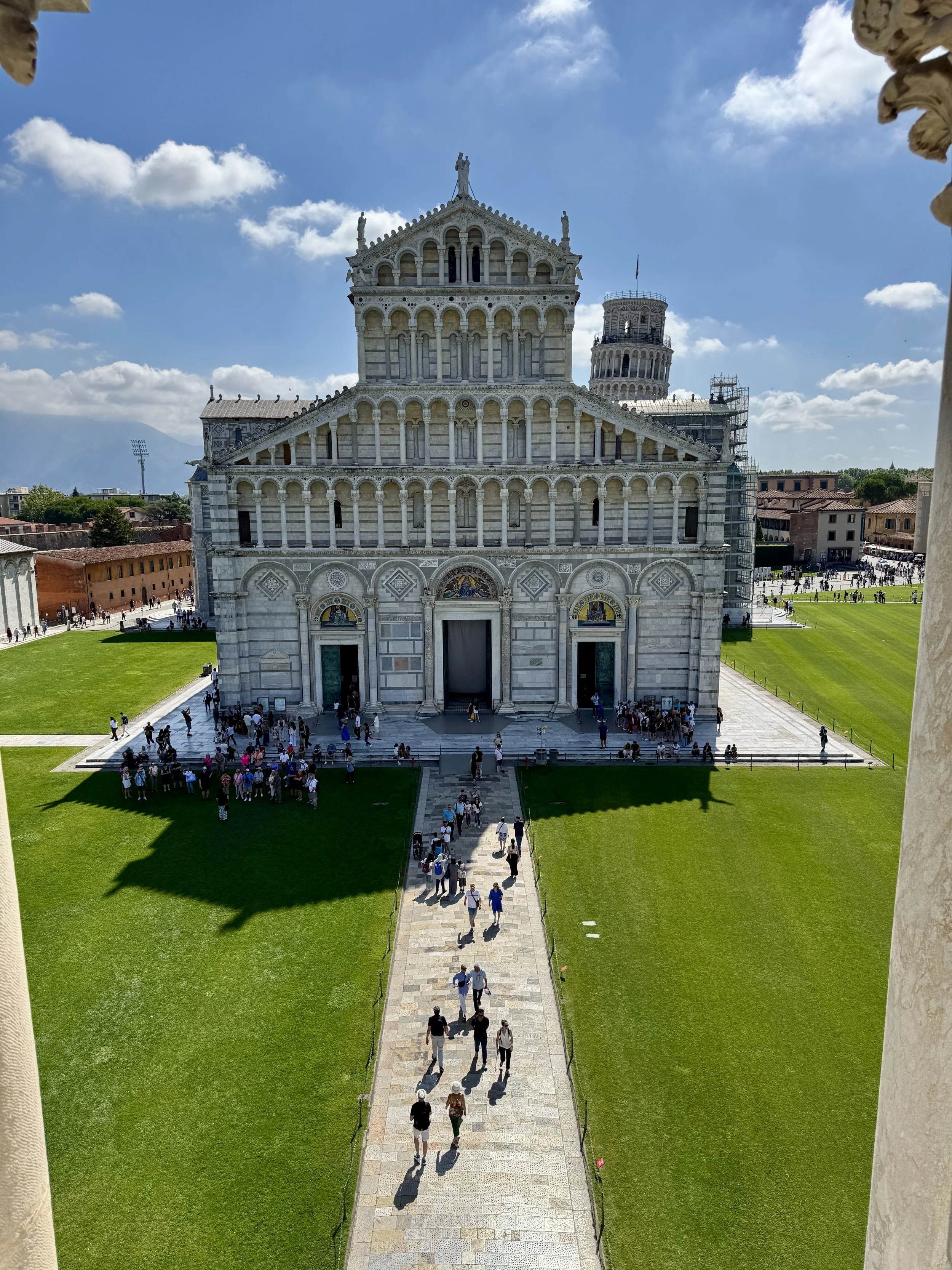 Elevated view of Pisa Cathedral and the Leaning Tower across Piazza dei Miracoli.