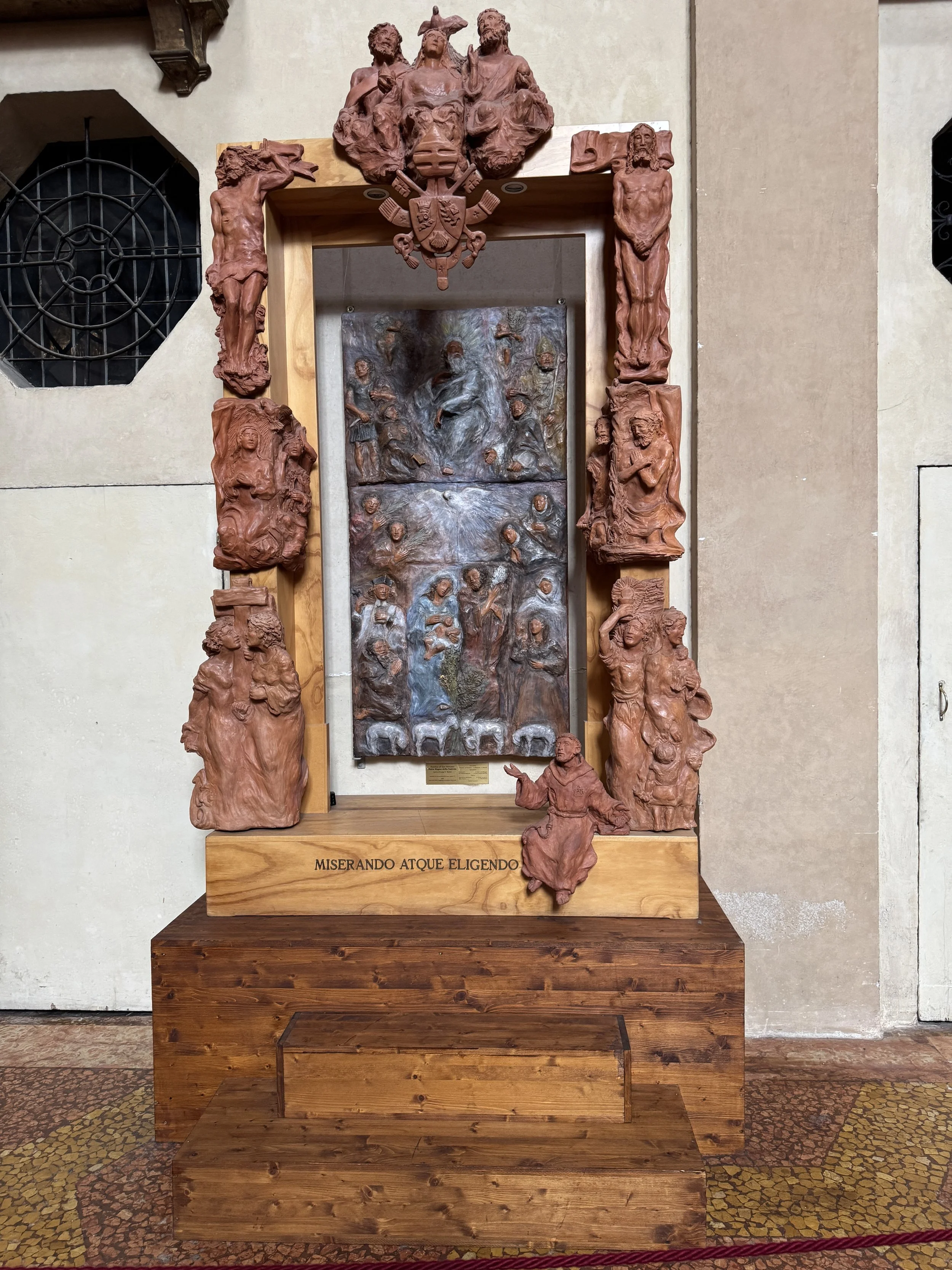 Decorative sculptural display photographed near Piazza Maggiore in Bologna.