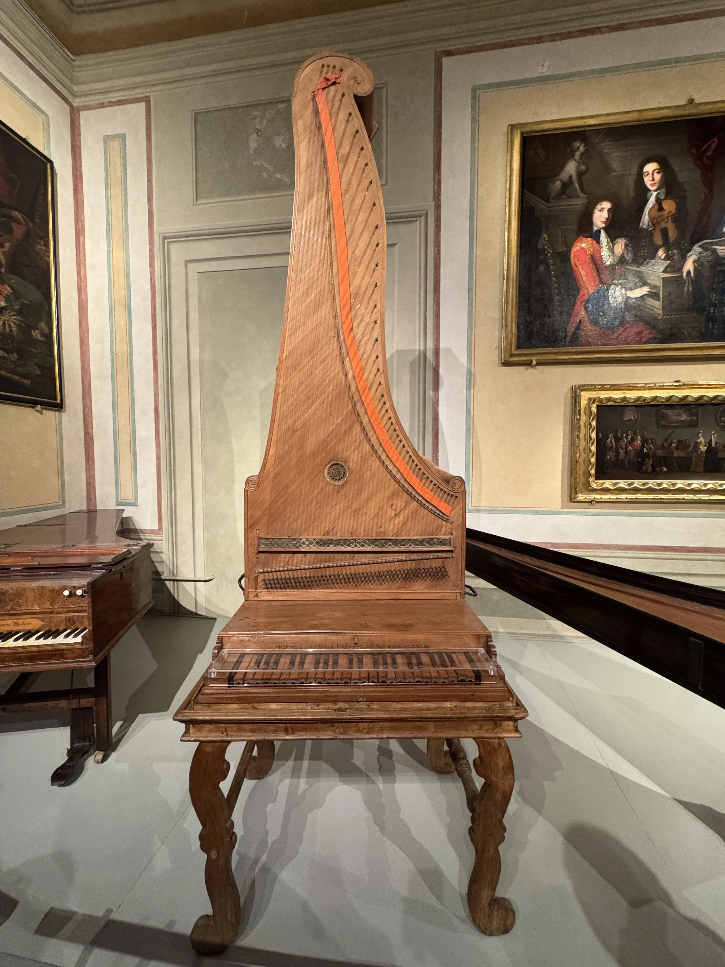 Historic harp and keyboard instrument in the Accademia’s musical instrument collection.