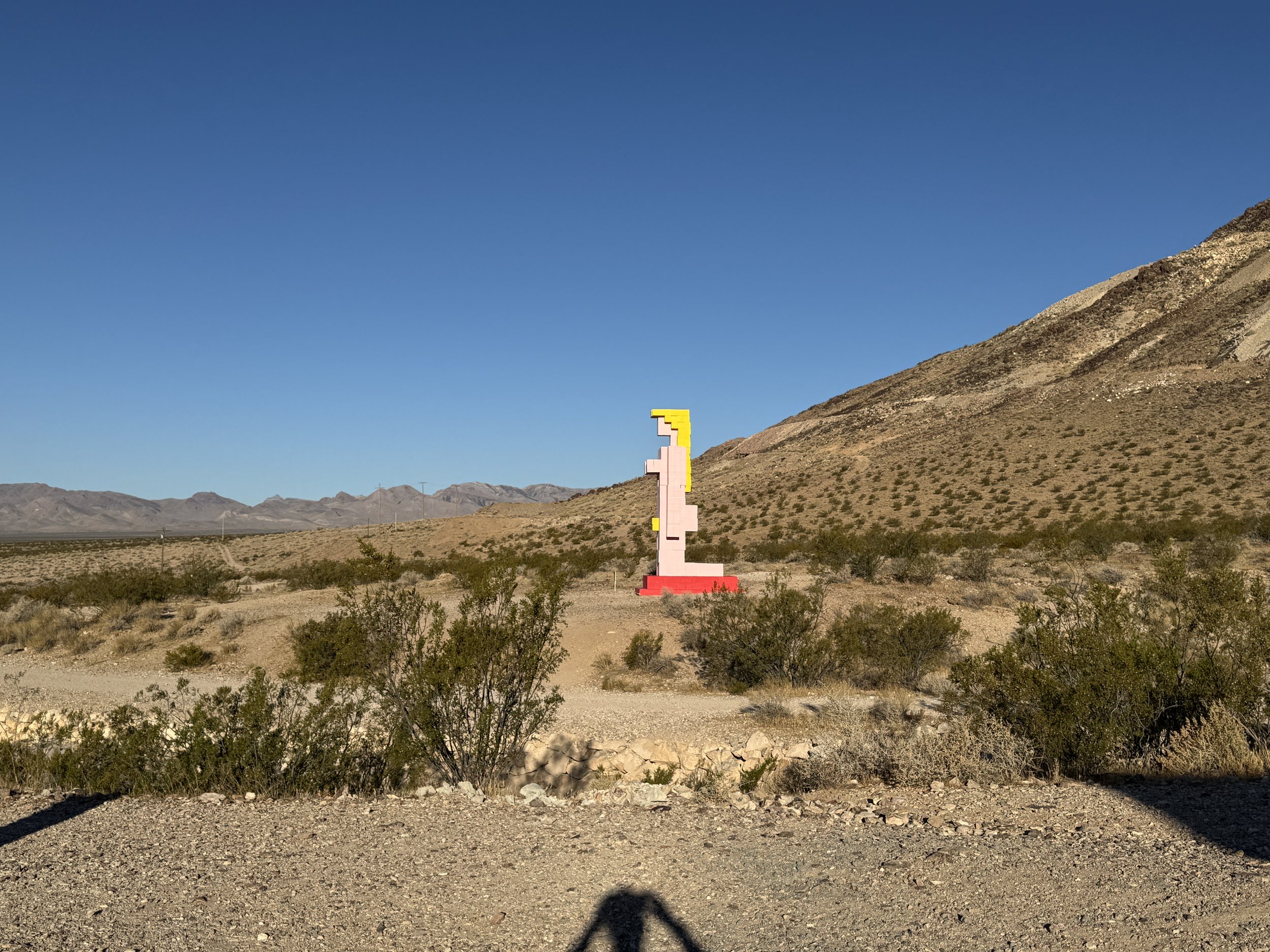 Geometric pink, yellow and red desert sculpture at the Goldwell Open Air Museum near Rhyolite, Nevada.