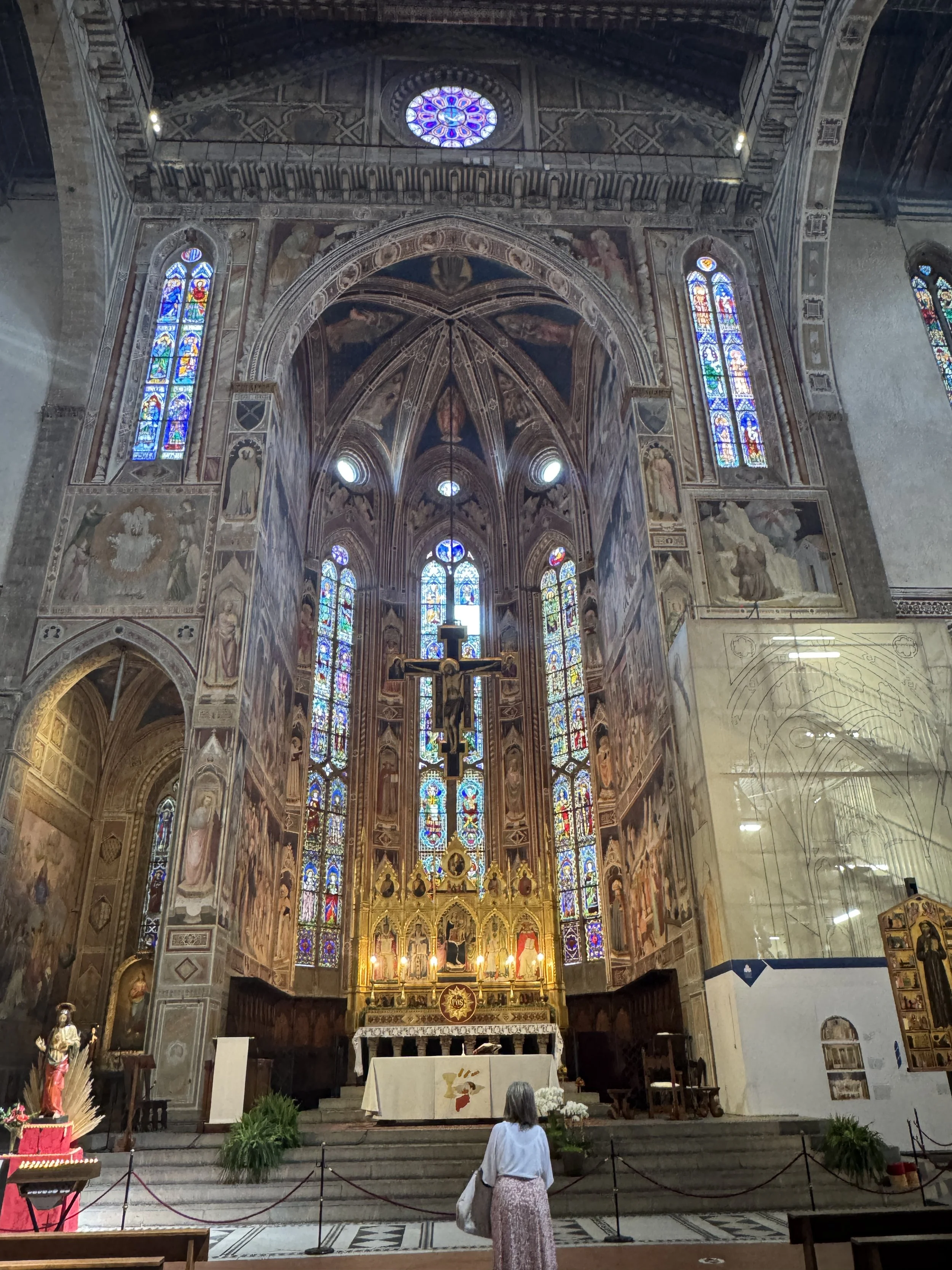 Stained-glass windows and ornate main altar inside the Basilica di Santa Croce.