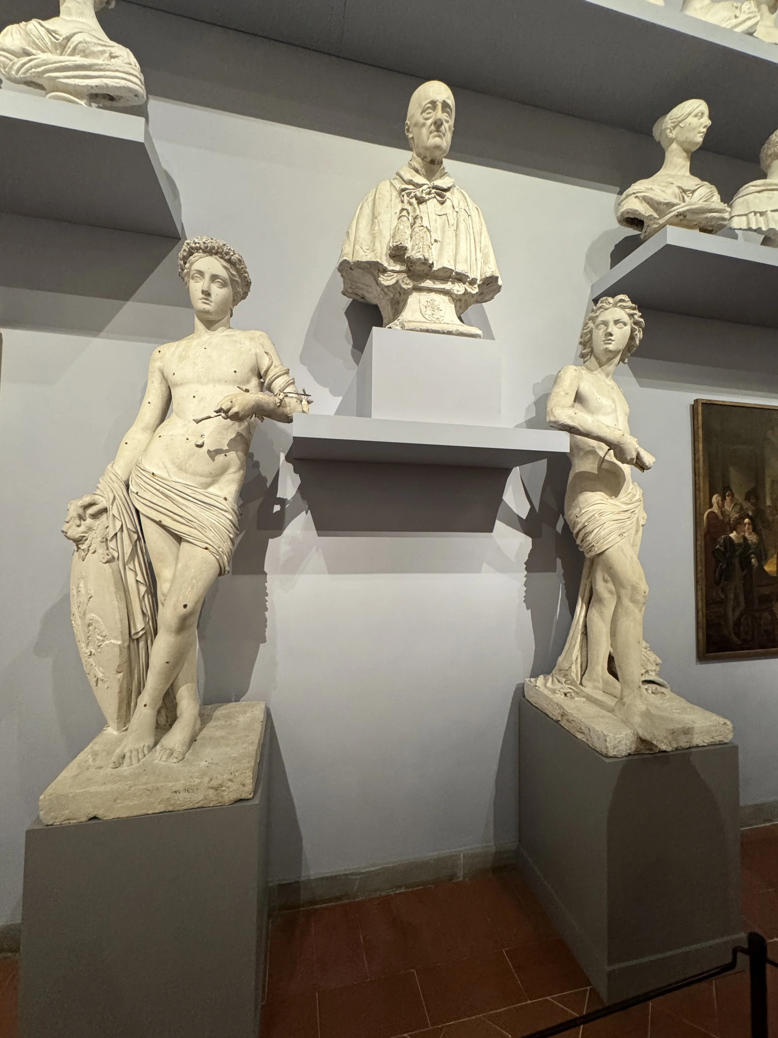 Historic marble sculptures and portrait busts displayed inside the Galleria dell’Accademia.
