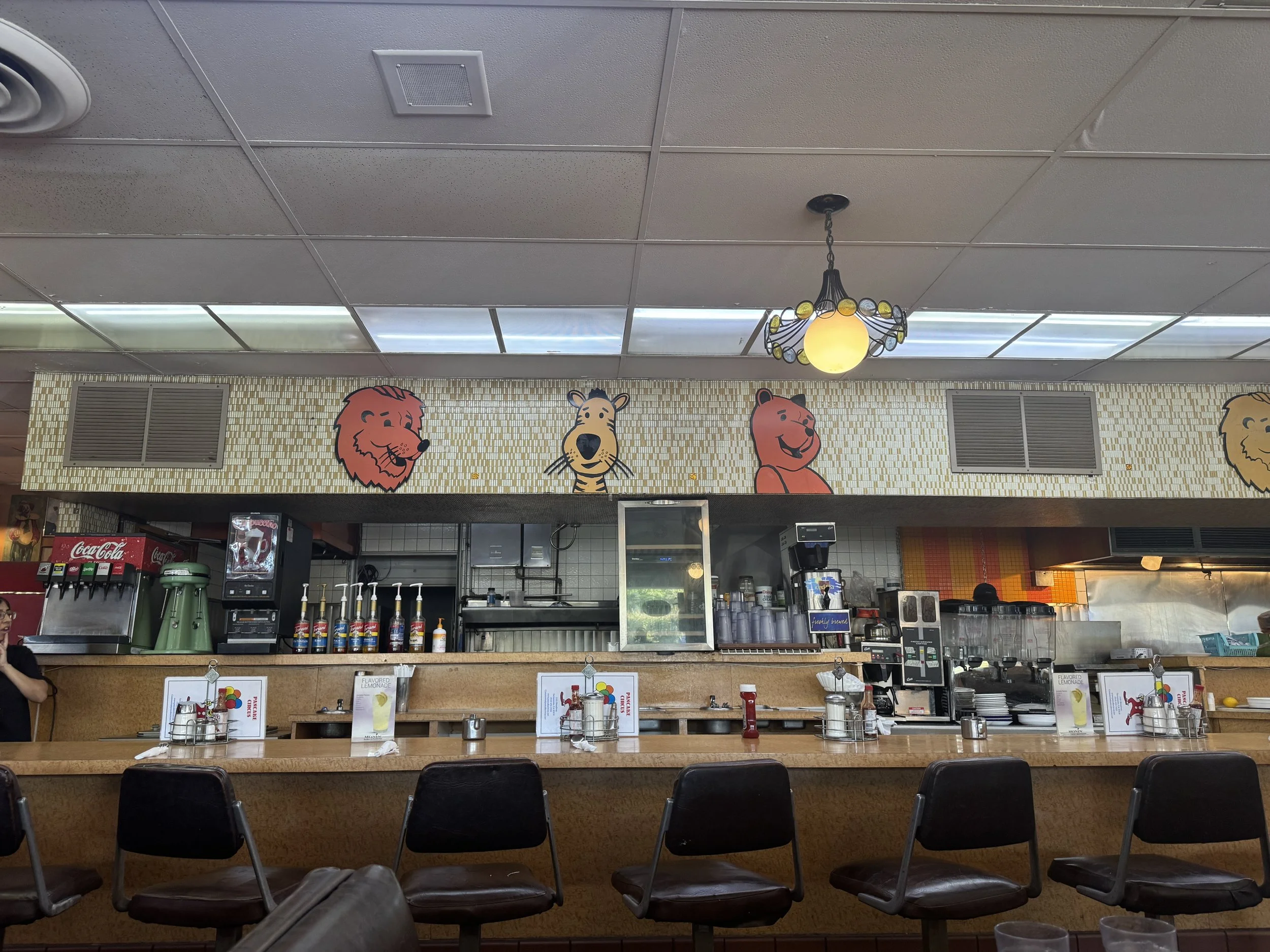 Old-school diner counter with animal faces and vintage fixtures inside Pancake Circus in Sacramento.