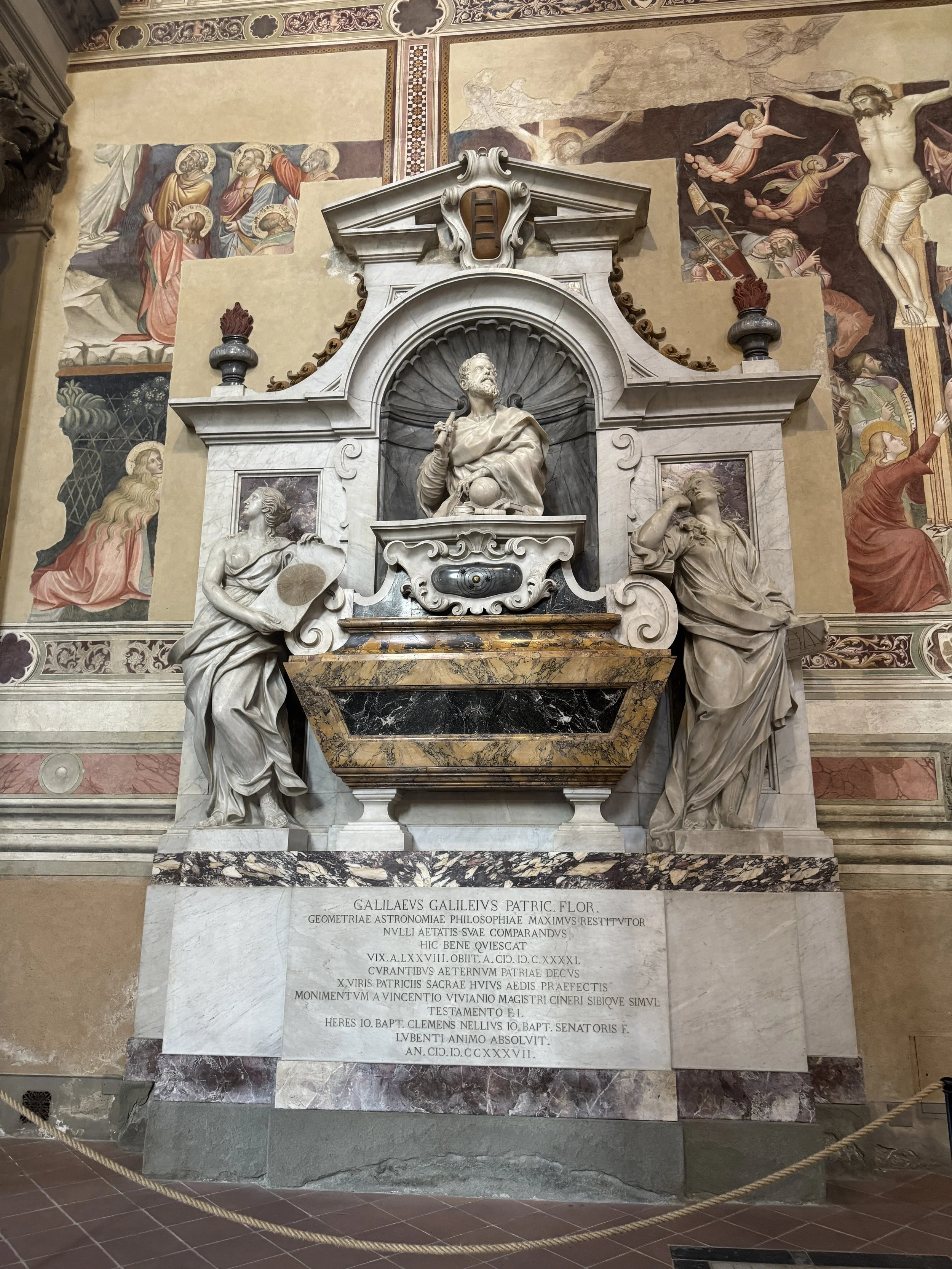 Elaborate marble tomb and sculptural memorial inside the Basilica di Santa Croce.