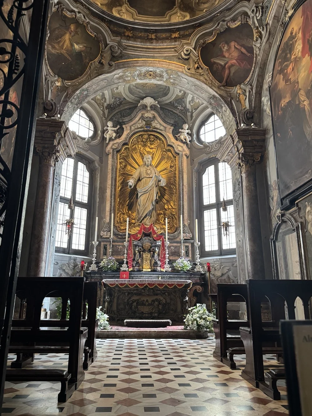 Ornate chapel altar and artwork inside Basilica di Sant’Ambrogio in Milan
