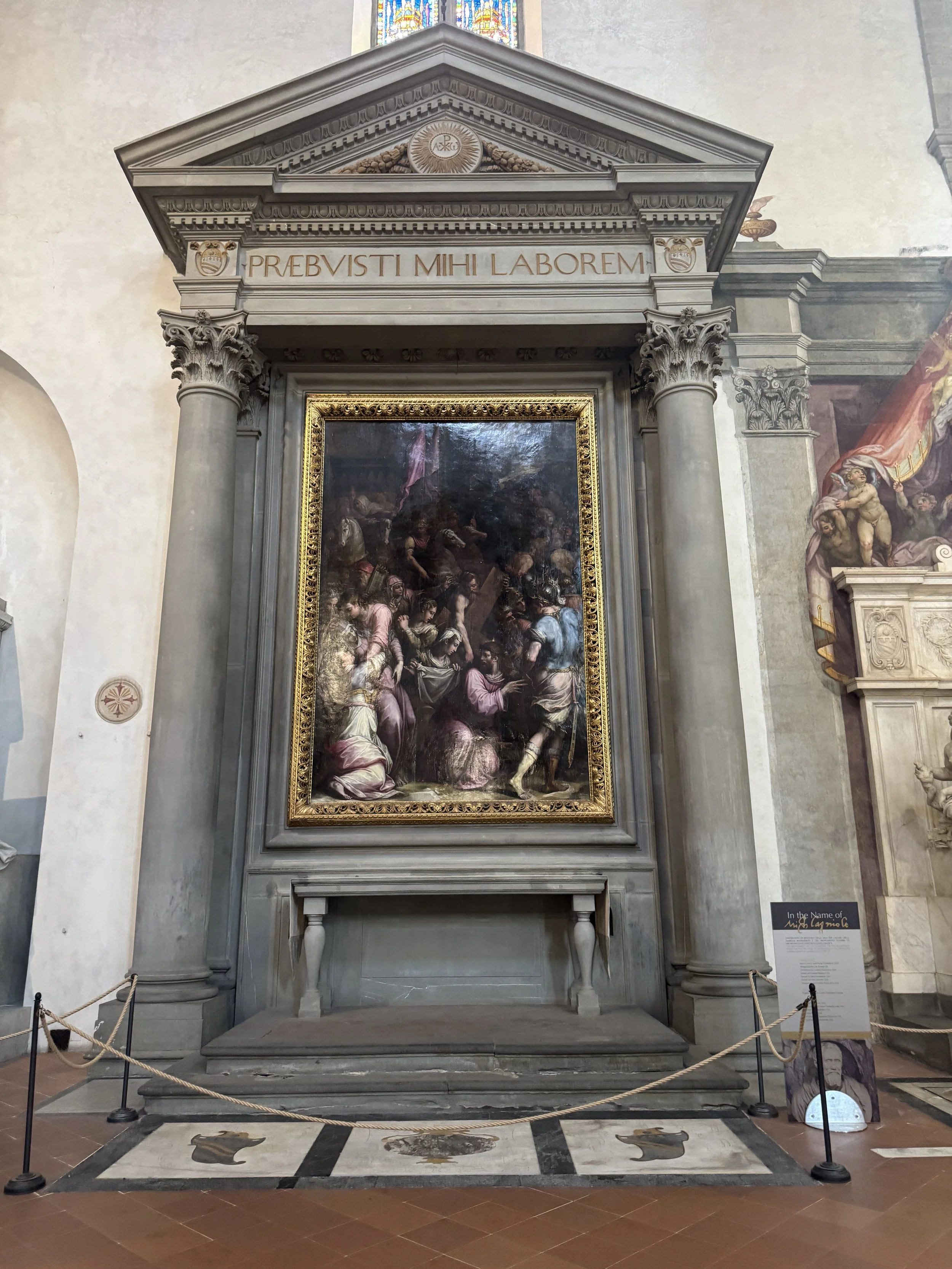 Framed religious painting and stone altar inside the Basilica di Santa Croce.