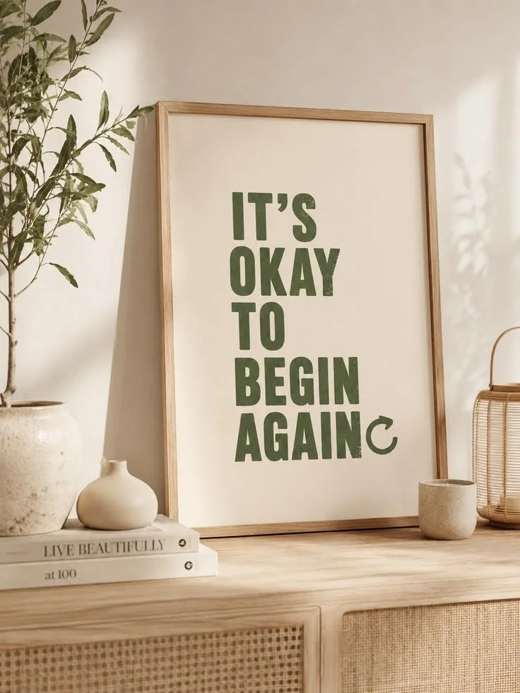 Framed print reading It's okay to begin again