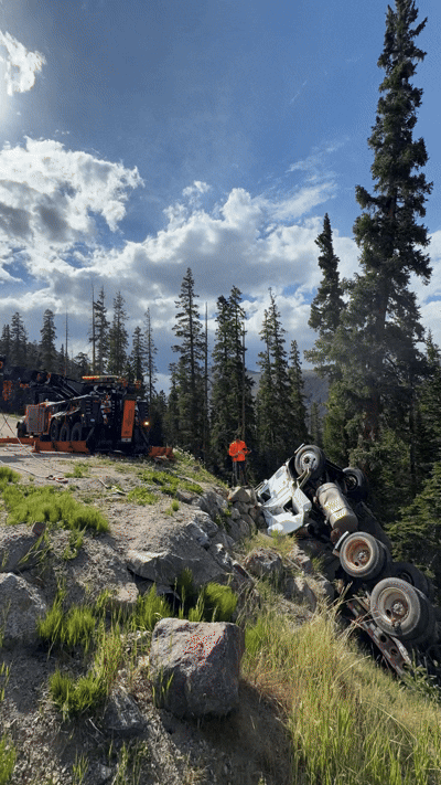 Mountain Recovery performing off-road vehicle recovery in rugged Colorado terrain