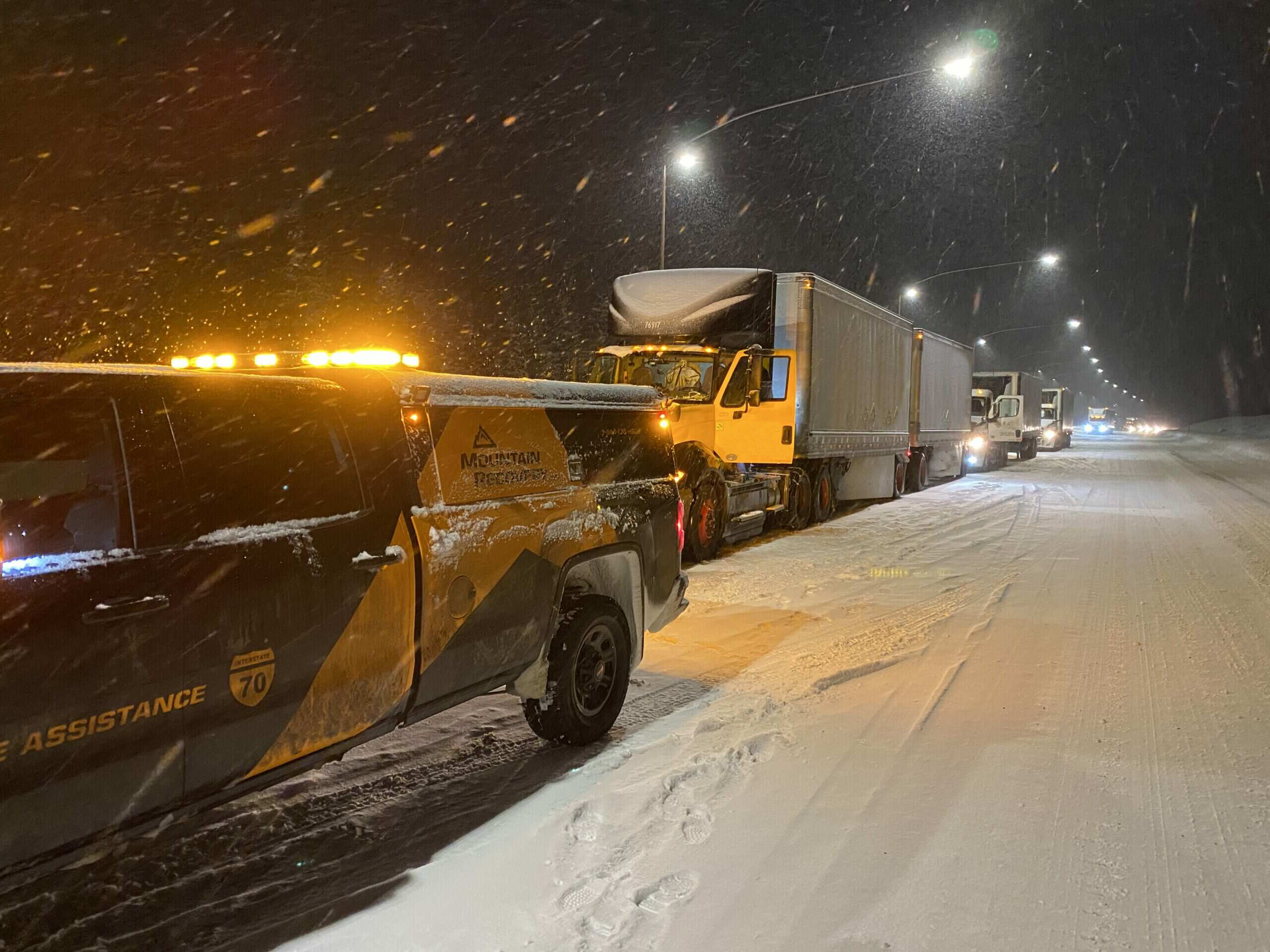 Mountain Recovery roadside assistance truck responding to a commercial vehicle in Colorado snow