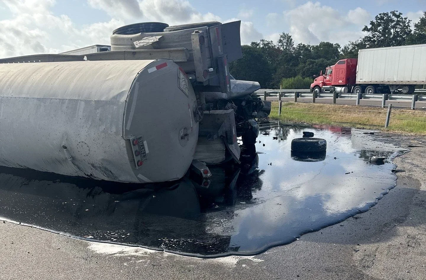 Mountain Recovery environmental response crew containing and cleaning a roadway spill in Colorado