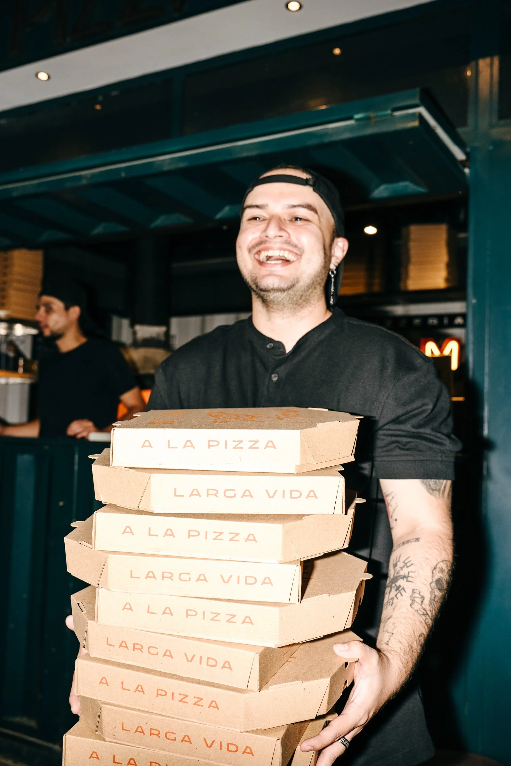Empaque y producto L'ermit Pizzería