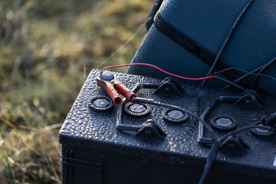 orange wire connects backup battery to inverter beside house