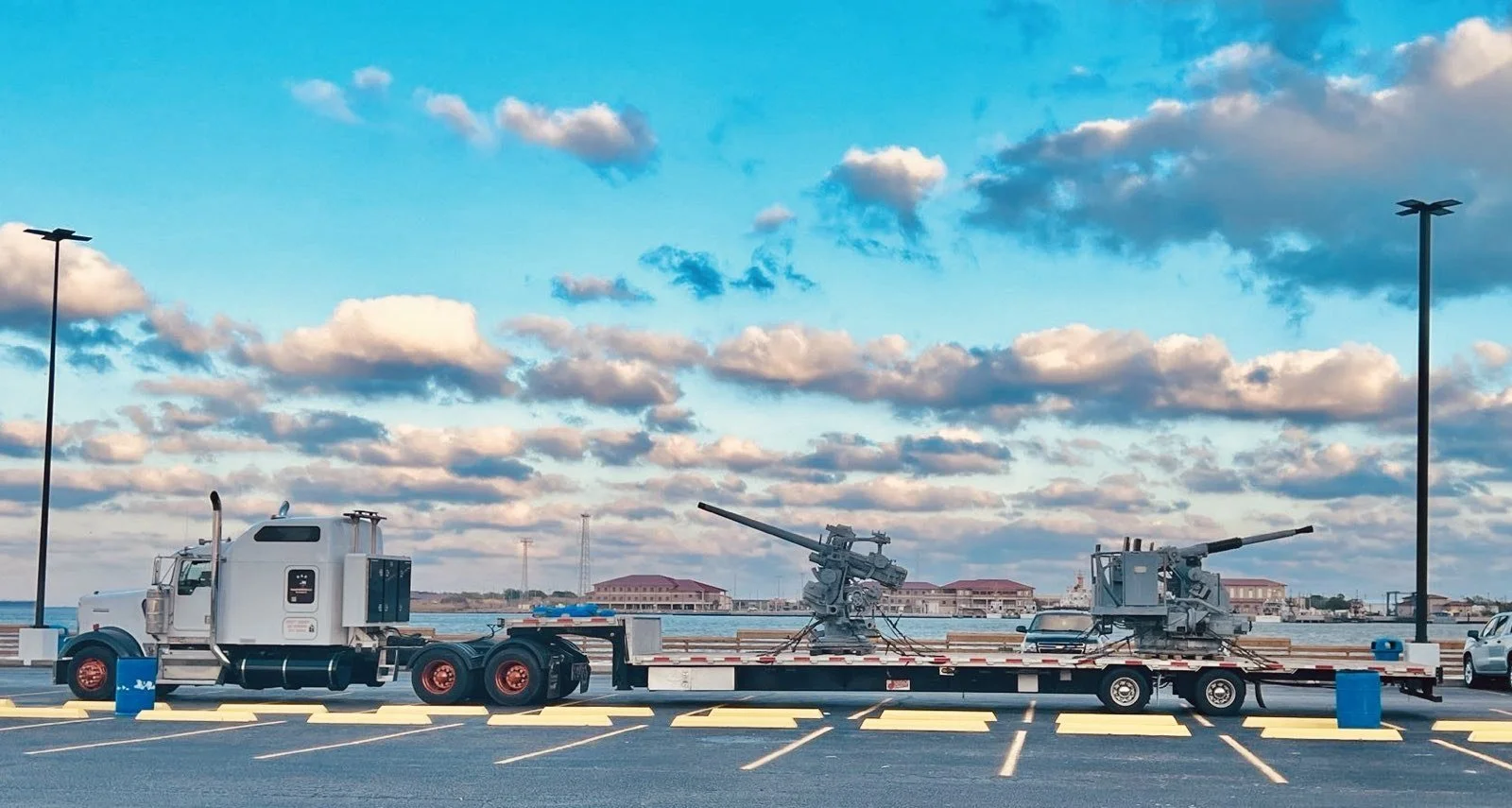 BAR Transportation hauling heritage artillery at naval waterfront facility