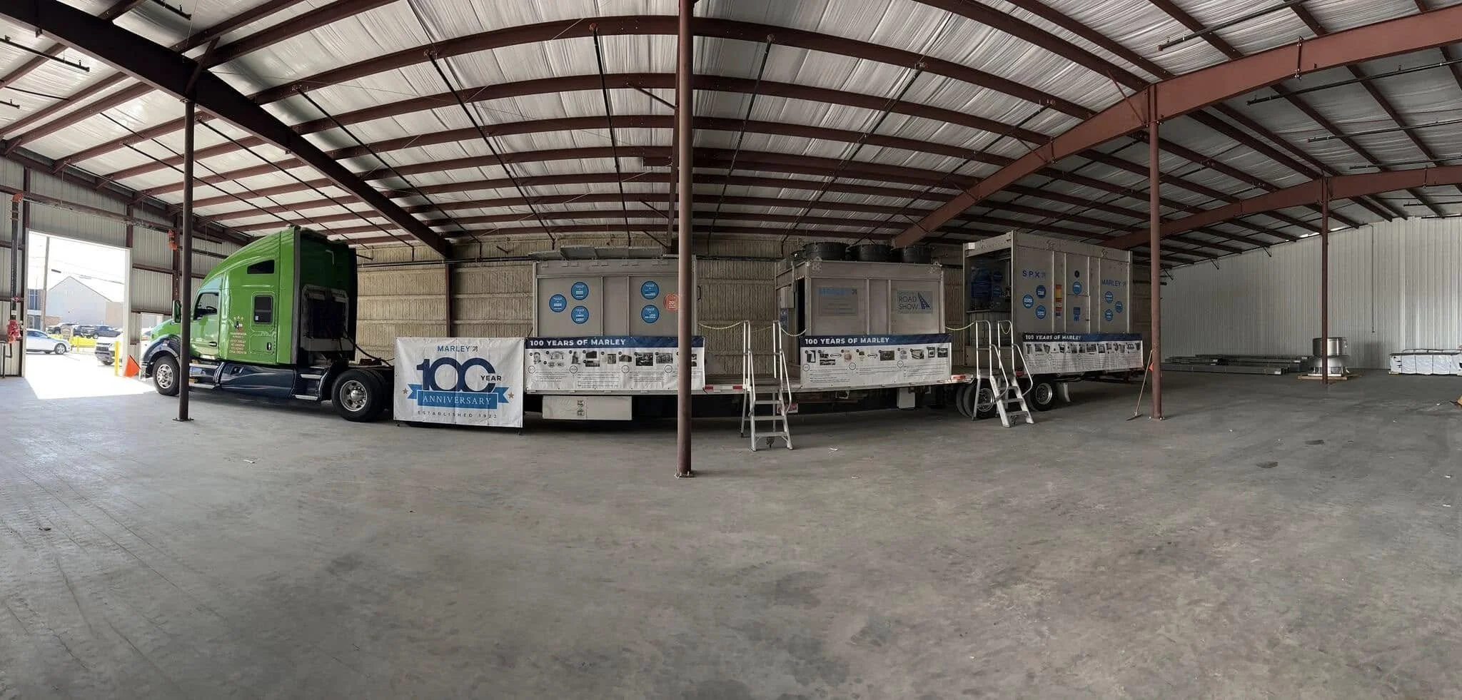 BAR Transportation green Kenworth hauling SPX Marley display units at Houston TX first stop