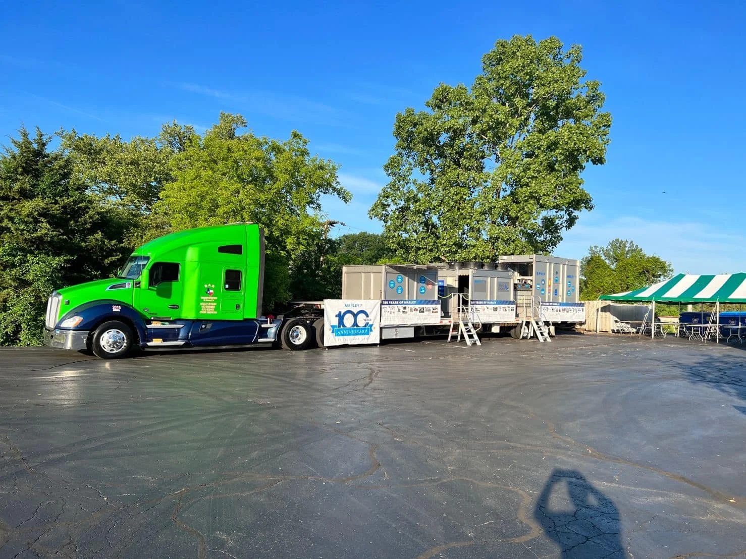 BAR Transportation green truck at Midwest stop with Marley 100th Anniversary banner