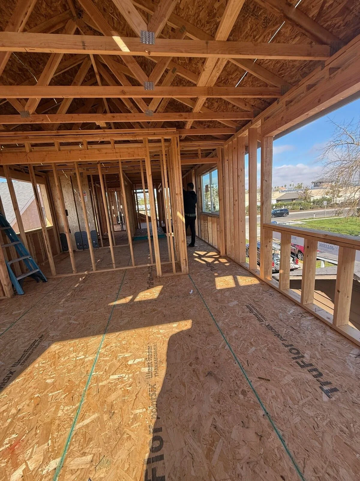Second-story framing with roof trusses — custom home, Fresno, CA
