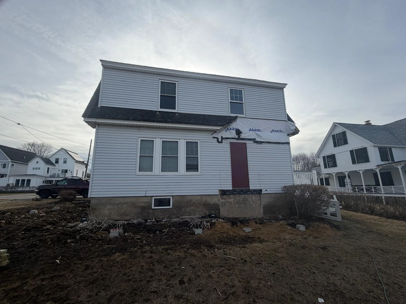 House wrapped and a new exterior door set during the winter build, York ME