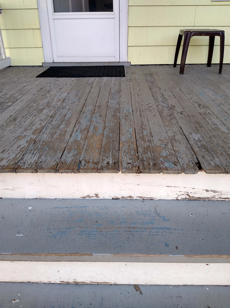 Cracked and peeling porch deck boards