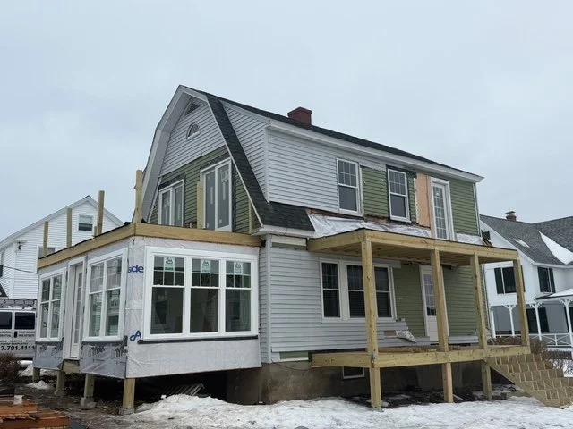 Both new porch structures framed in the snow during construction, York ME