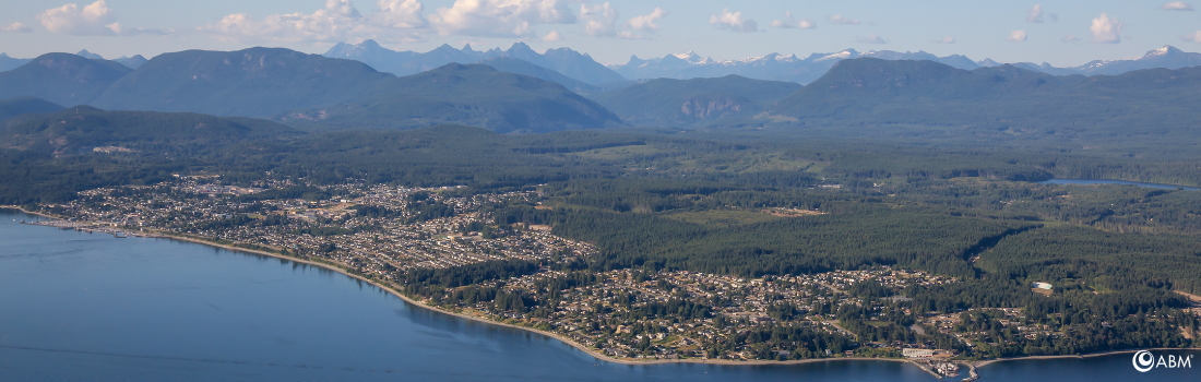 Aerial view of qathet and the surrounding mountains, location of the 2026 ABM Annual Community Gathering.