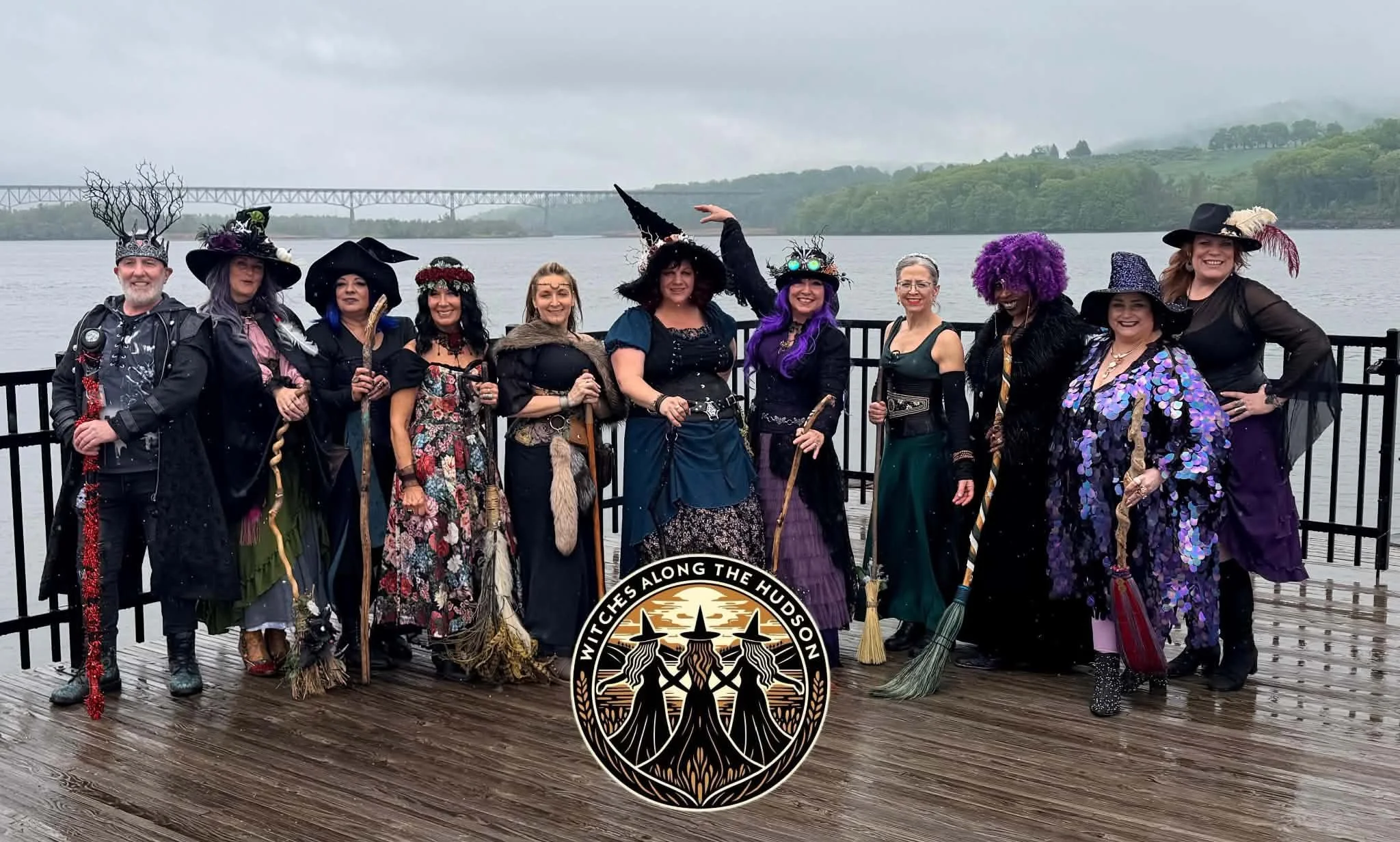 Witches Along the Hudson dance troupe gathered on a boardwalk beside the Hudson River