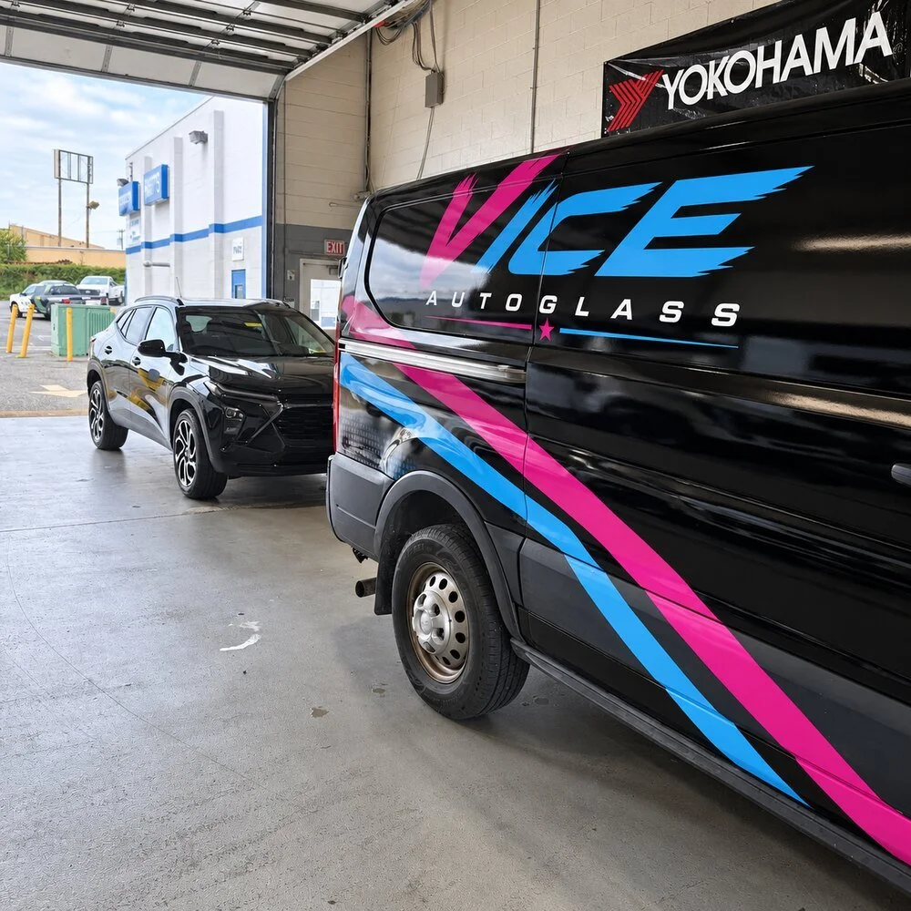 Vice Autoglass service van inside a dealership service bay