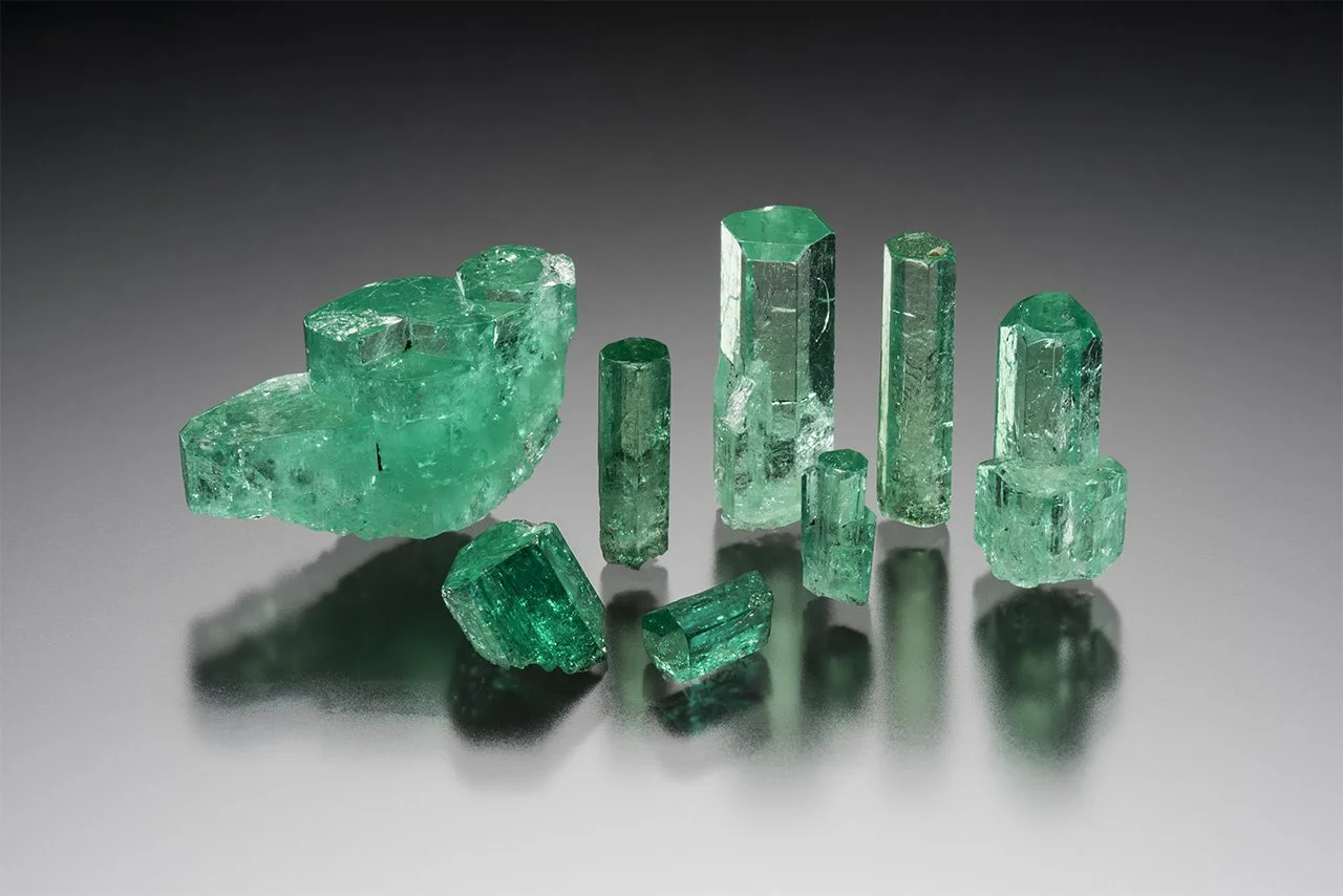 Natural emerald showing vivid green colour and characteristic inclusions