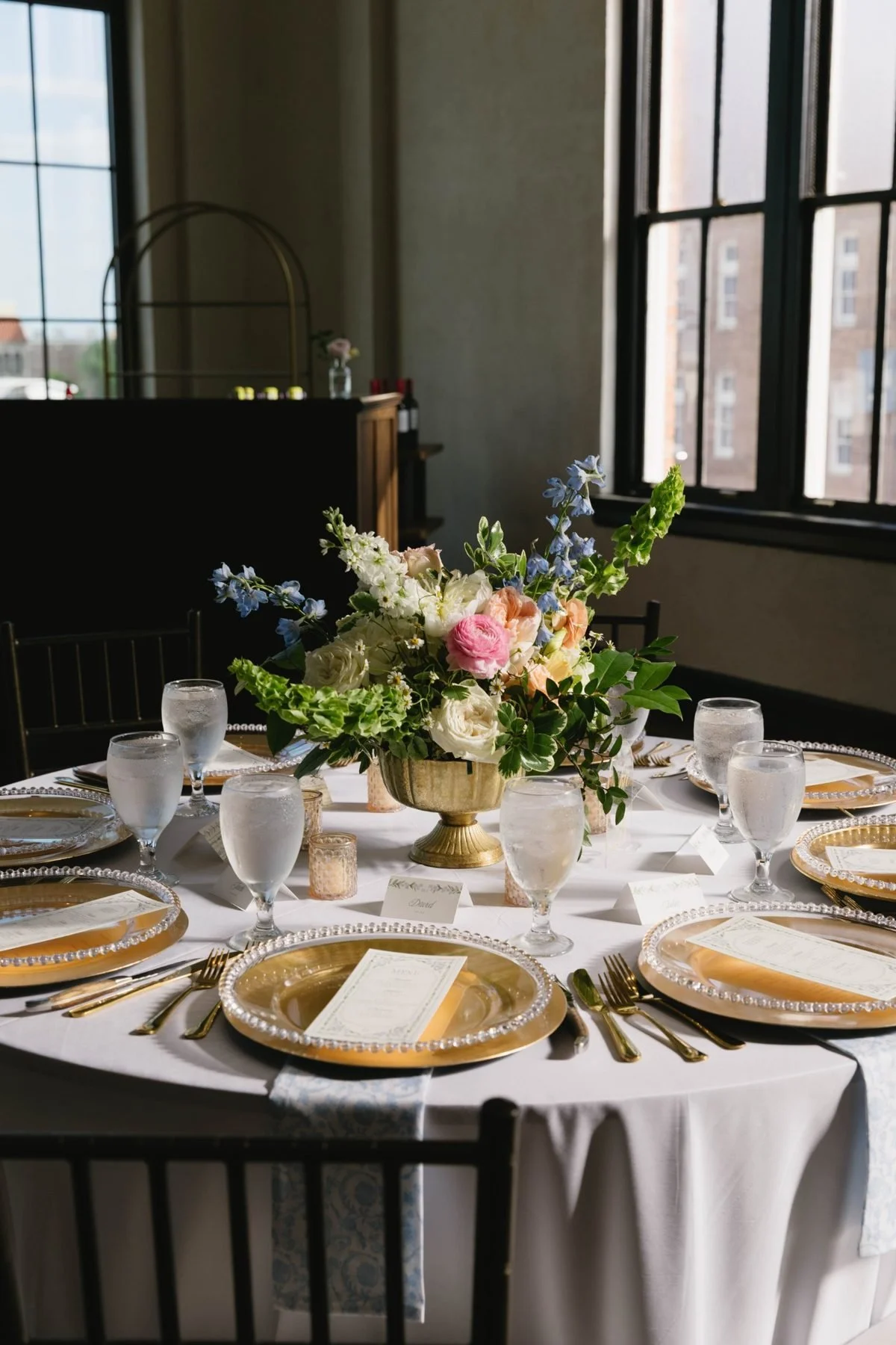Gold compote centerpiece in afternoon light