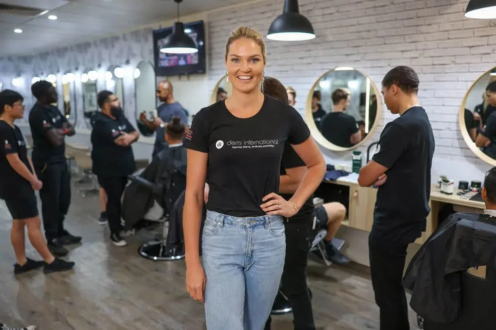 Demi International barbering students training in the salon