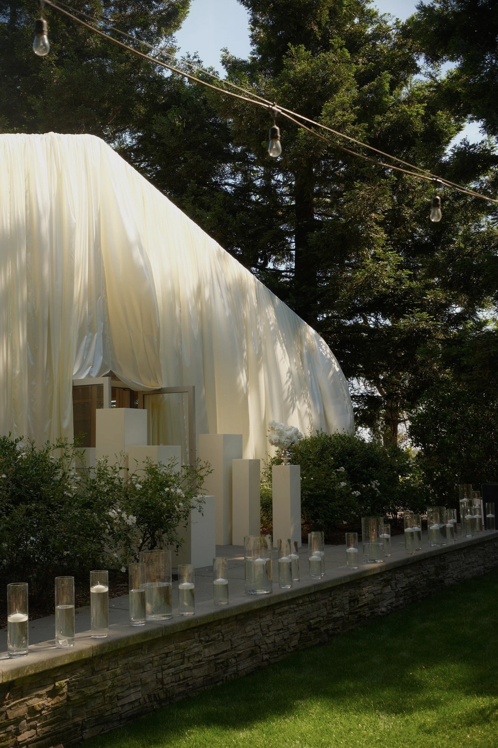White ceremony draping in the garden