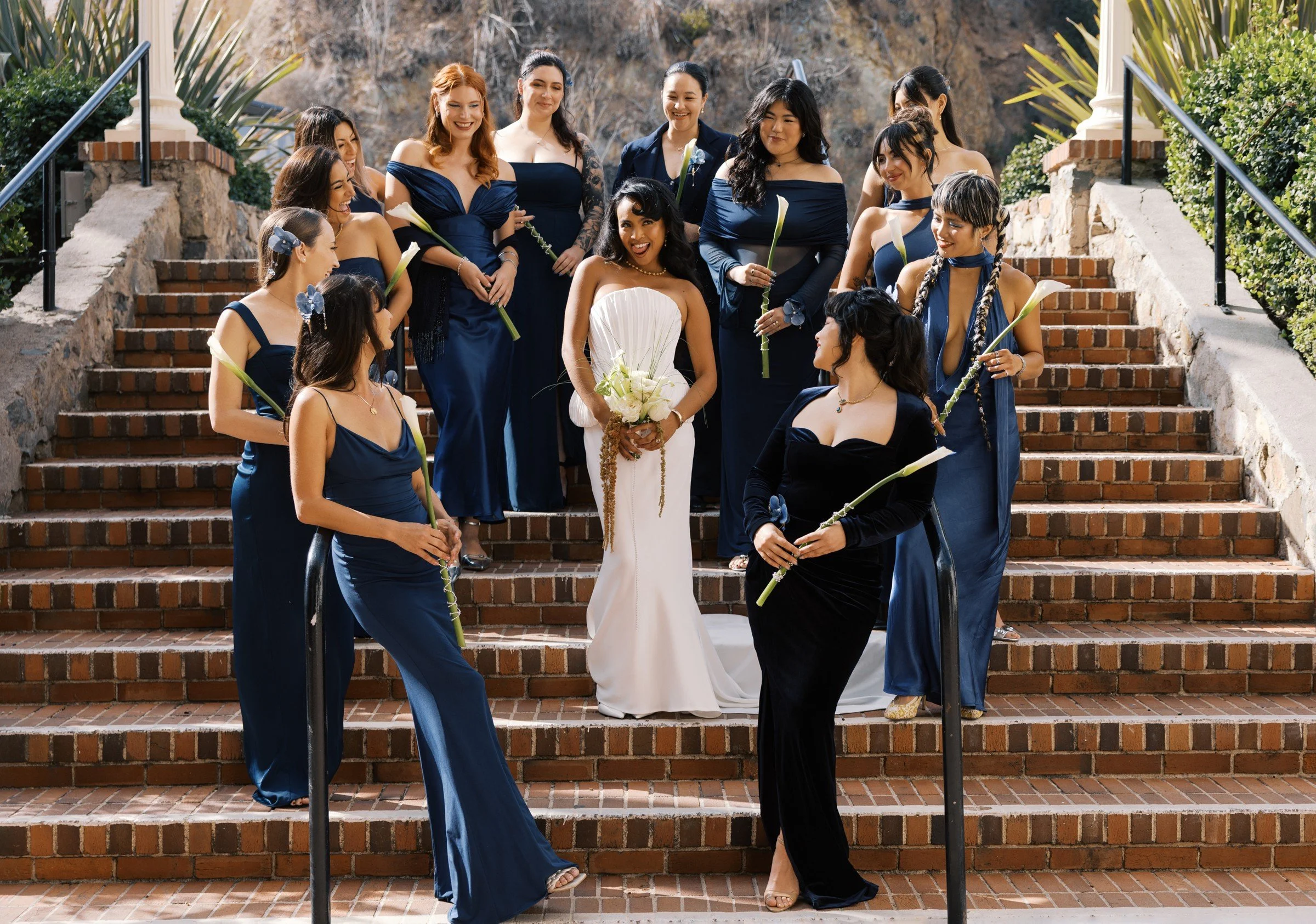 Wedding party gathered on terracotta steps