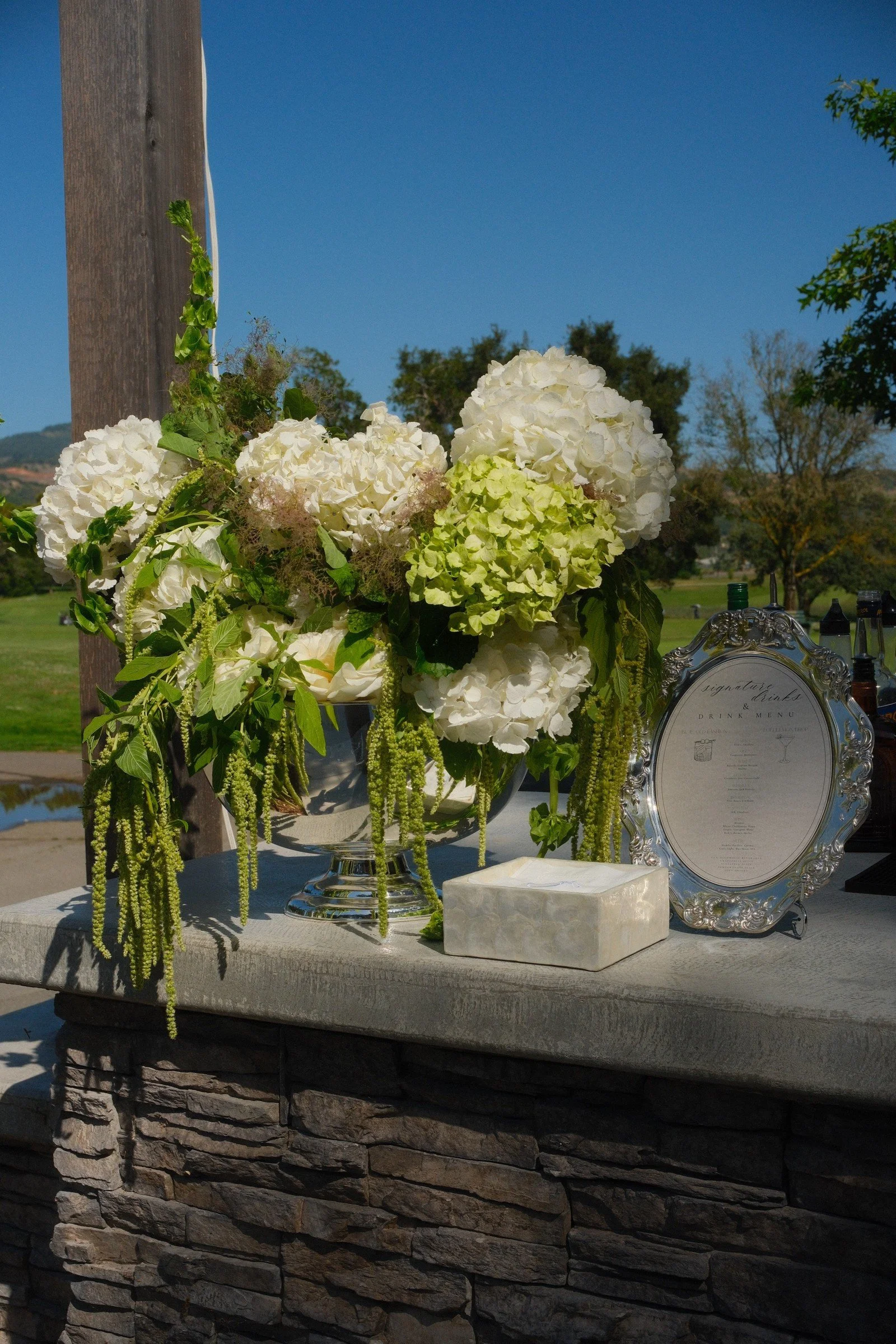 White and green flowers on a reception table