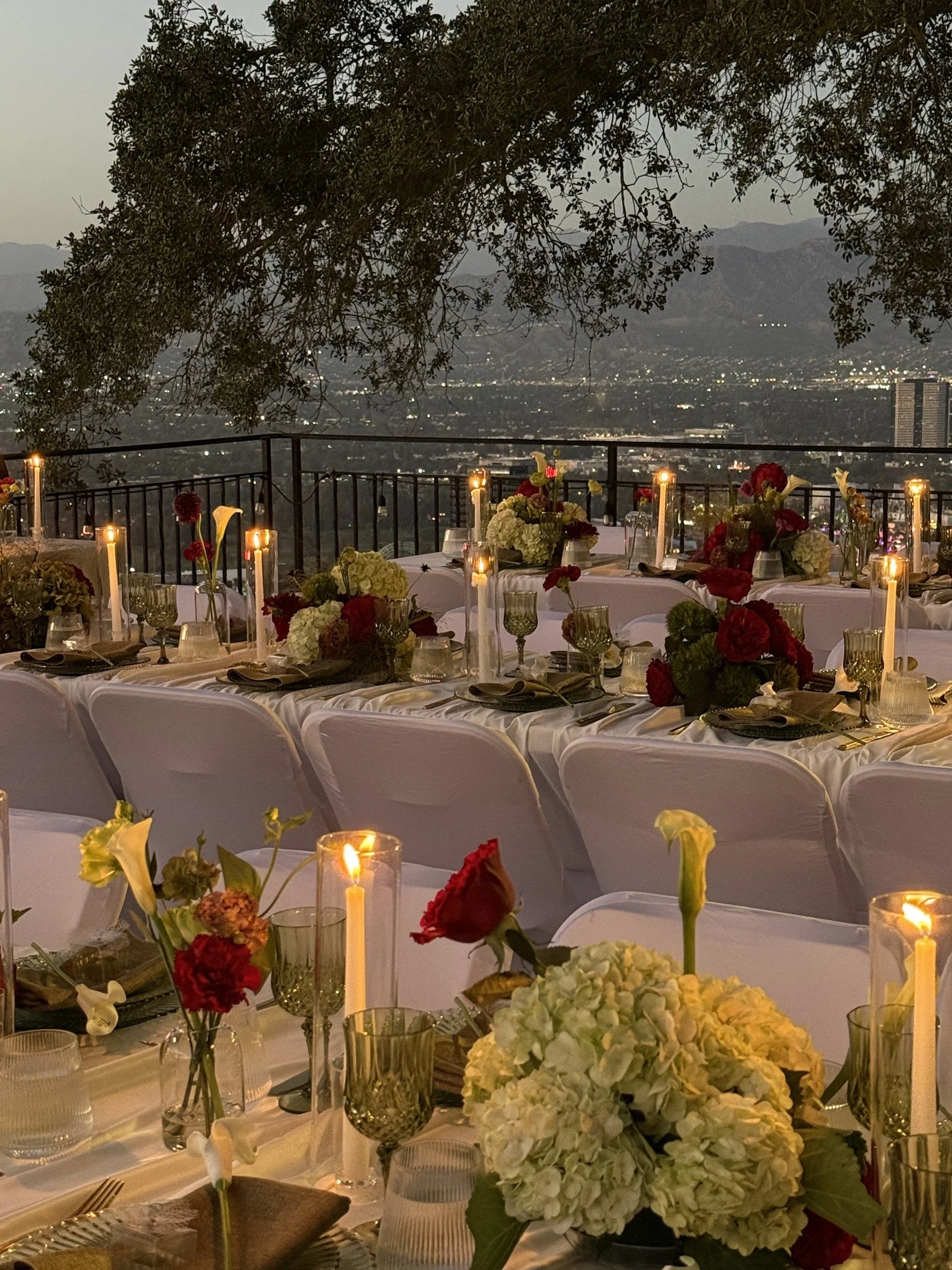 Candlelit reception tables overlooking Los Angeles