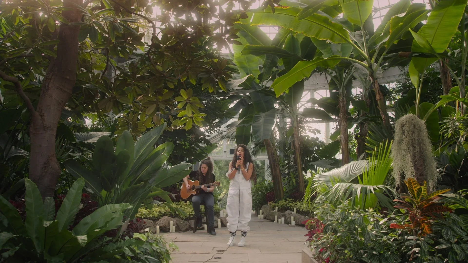Jessie Reyez and guitarist Heather Crawford in live music video performance for Jessie Reyez