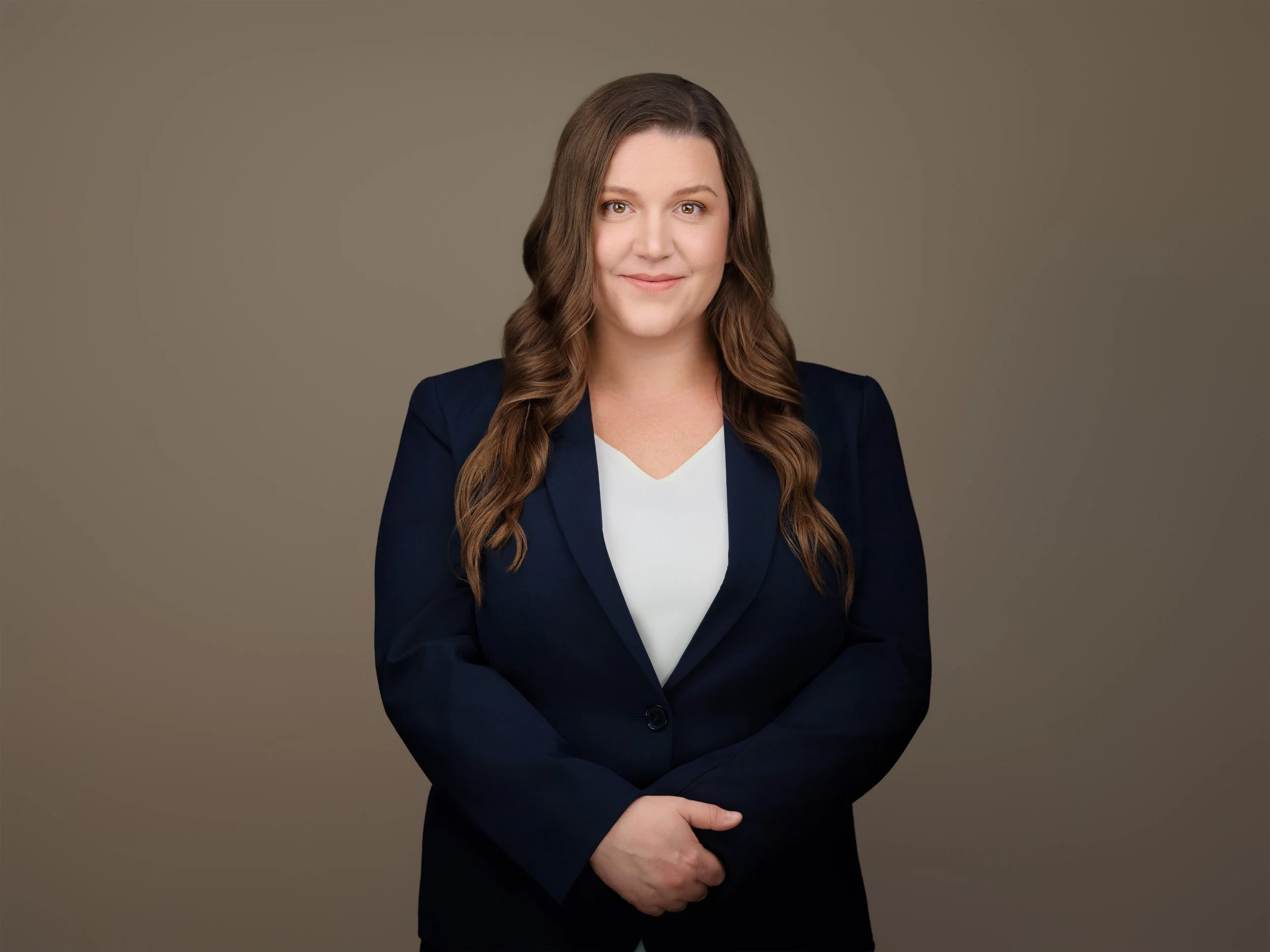 Rachel Porter standing in a navy suit
