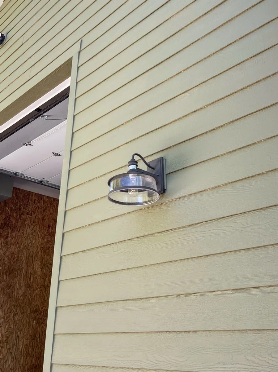 Sage green lap siding installed by Corbridge Construction in Cache Valley, Utah