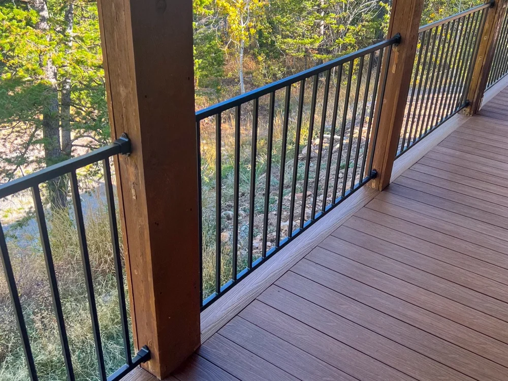 Composite decking and black railing on a covered deck at Bear Lake