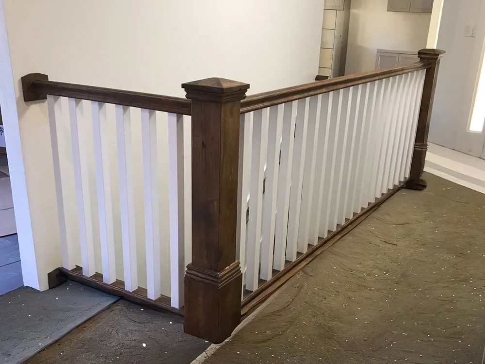 Custom stair railing and newel posts by Corbridge Construction