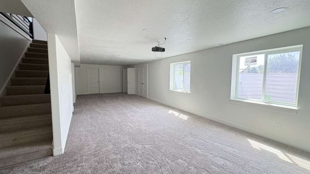 Finished basement family room in Cache Valley by Corbridge Construction