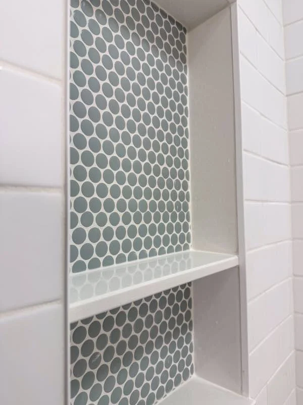 Penny-tile shower niche, North Logan by Corbridge Construction