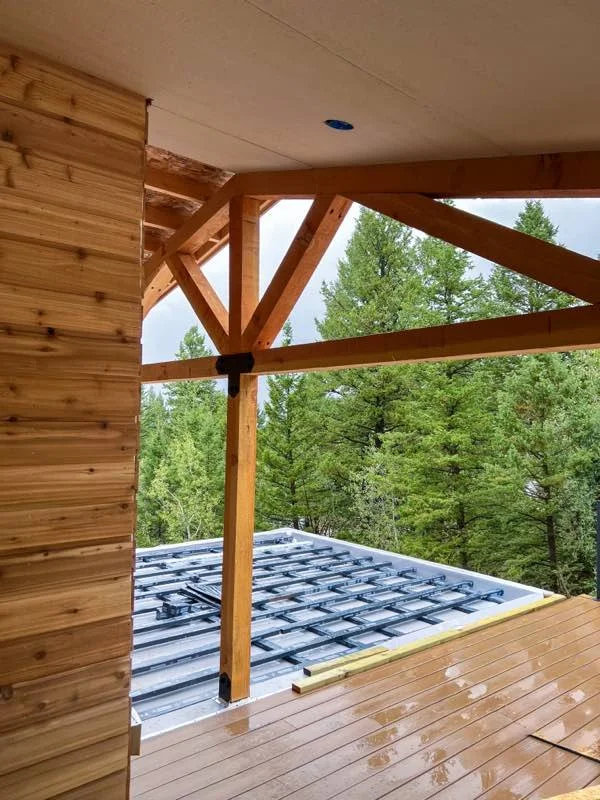 Timber-frame deck cover at Bear Lake by Corbridge Construction