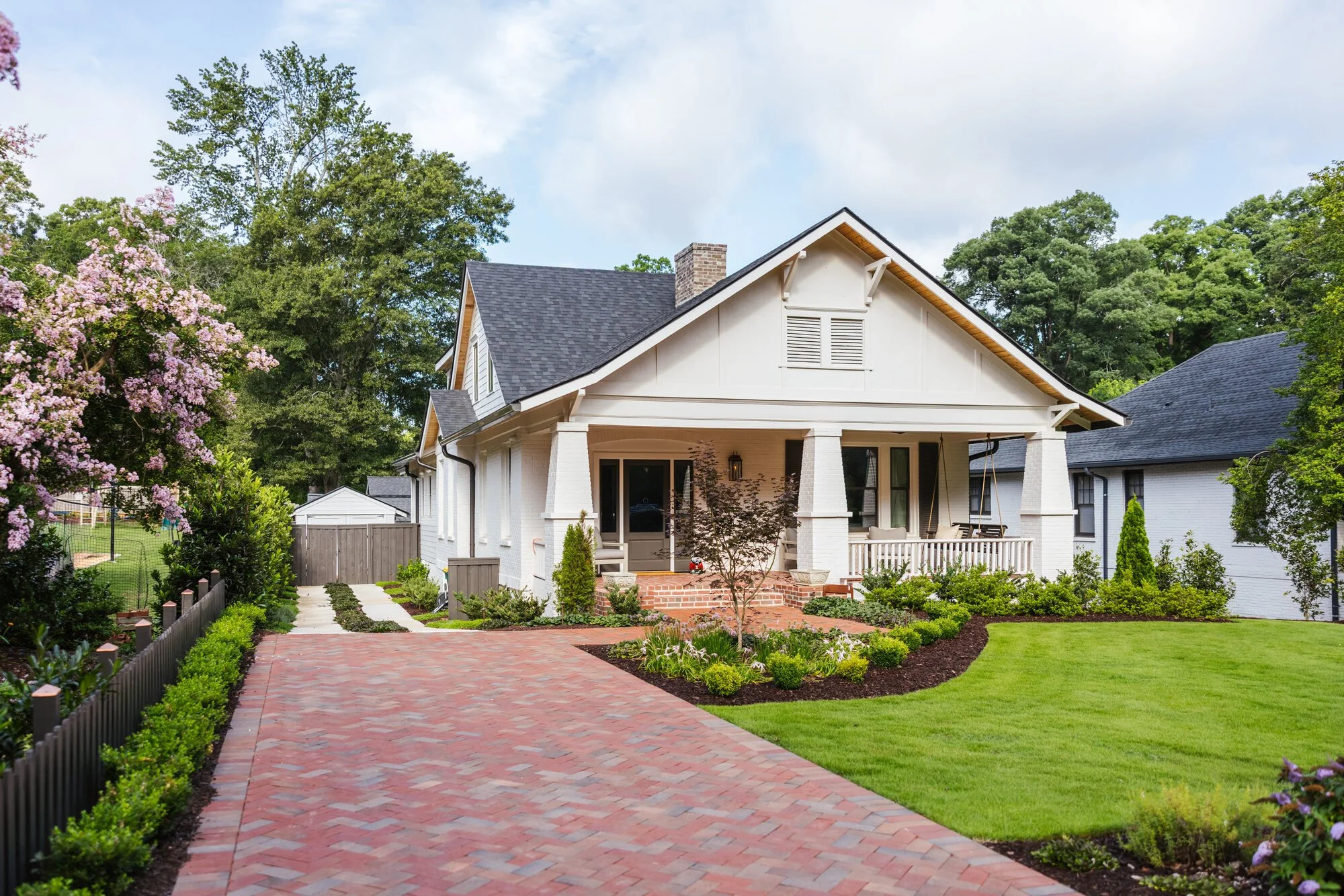 Brick motor court and open lawn in front of the Cherokee residence