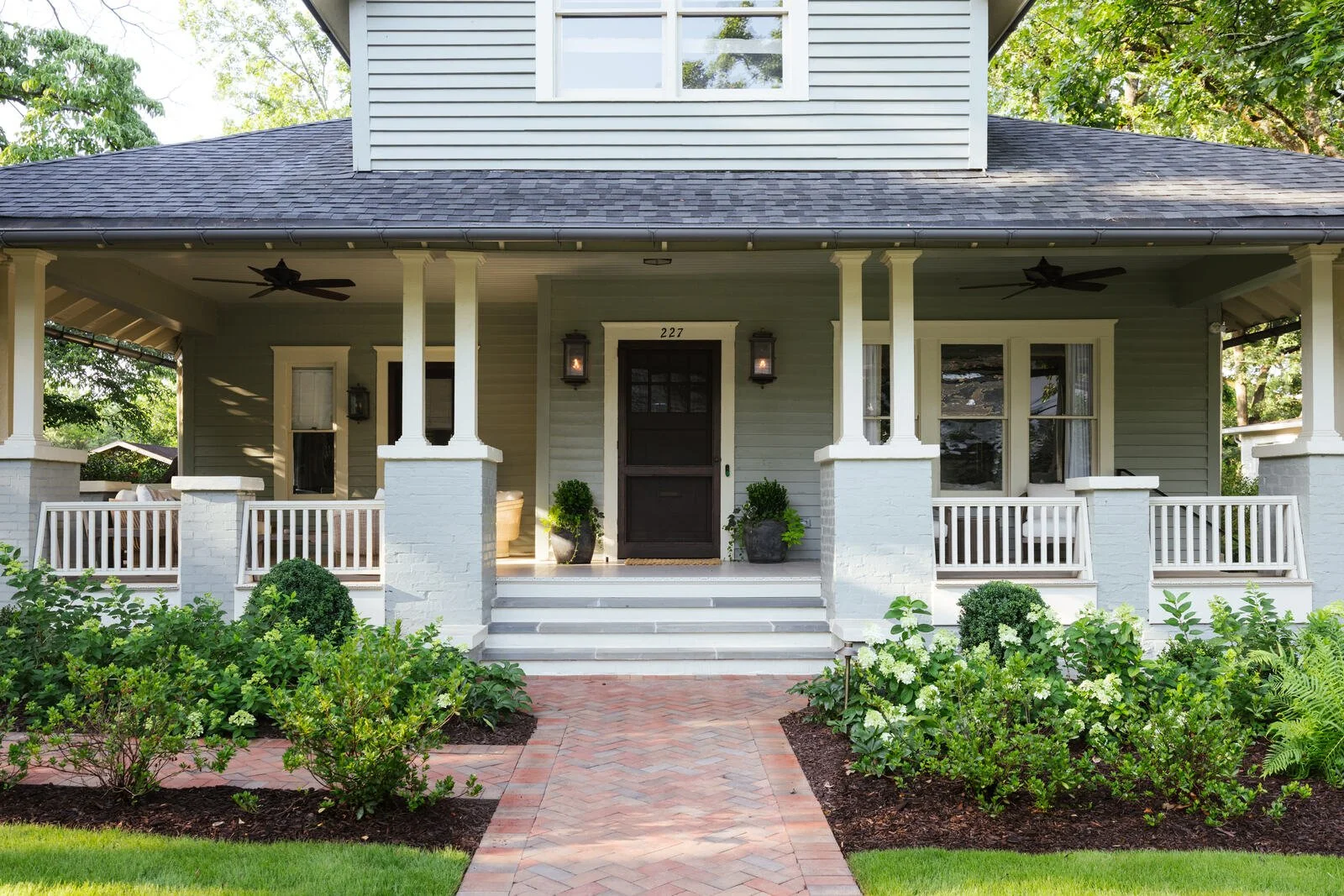 Brick front walk leading to the Craftsman porch at the Five Points residence