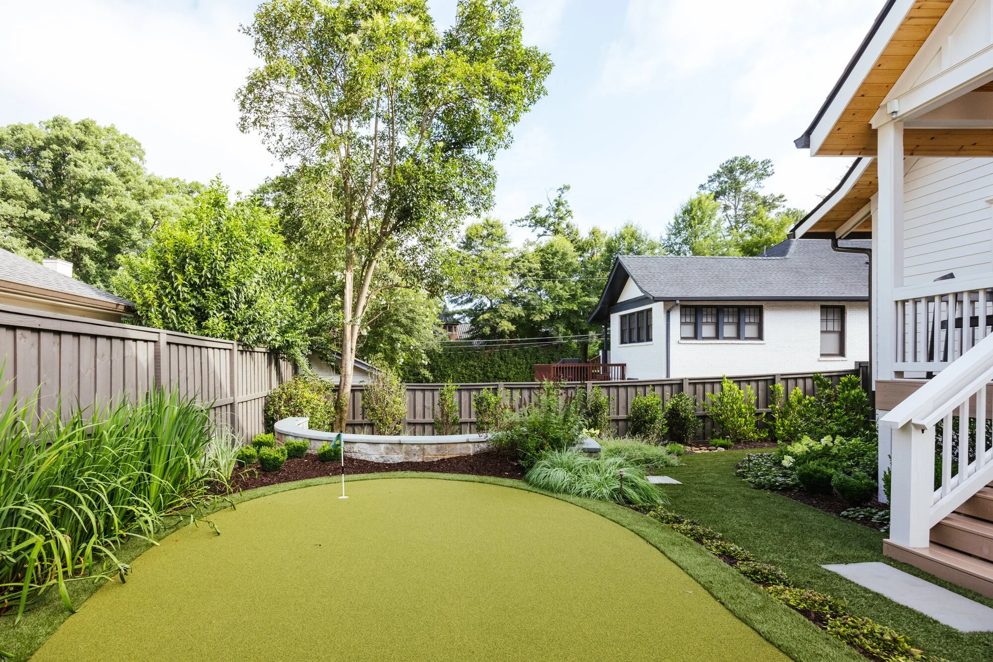Contoured backyard putting green at the Cherokee residence