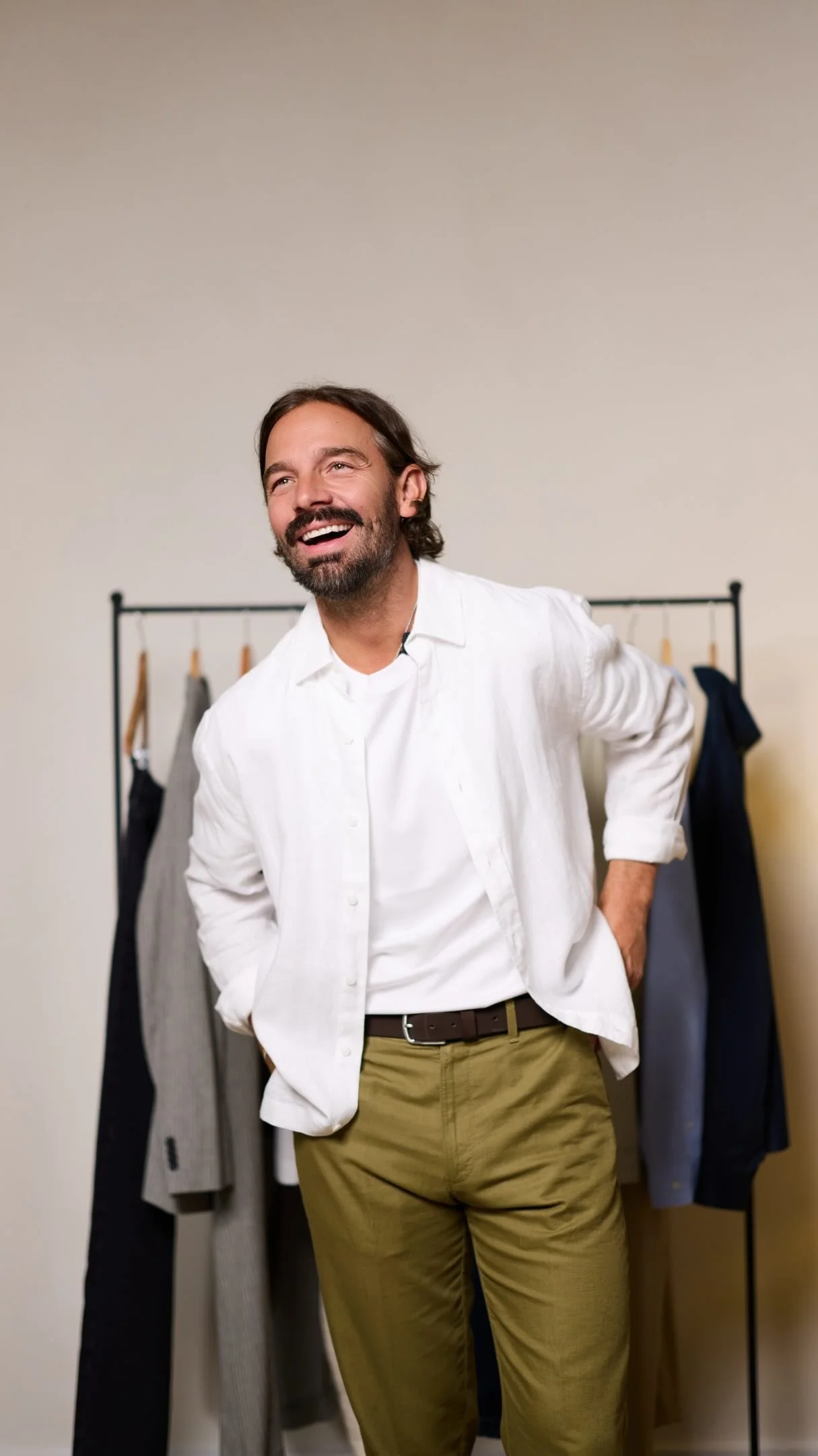 Krissy, menswear stylist and second lead at Jawdrop, beside a clothing rail