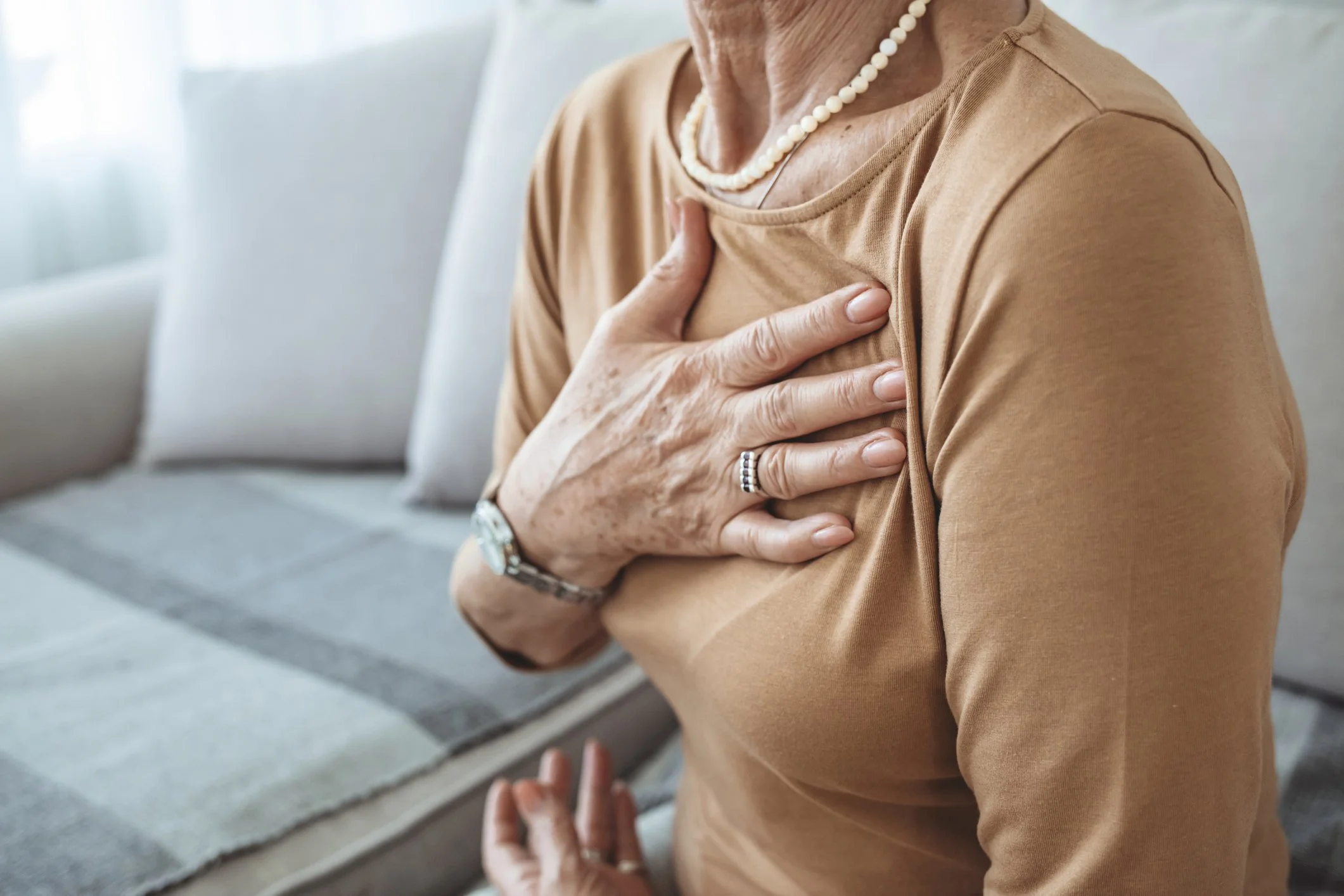 Woman holding chest