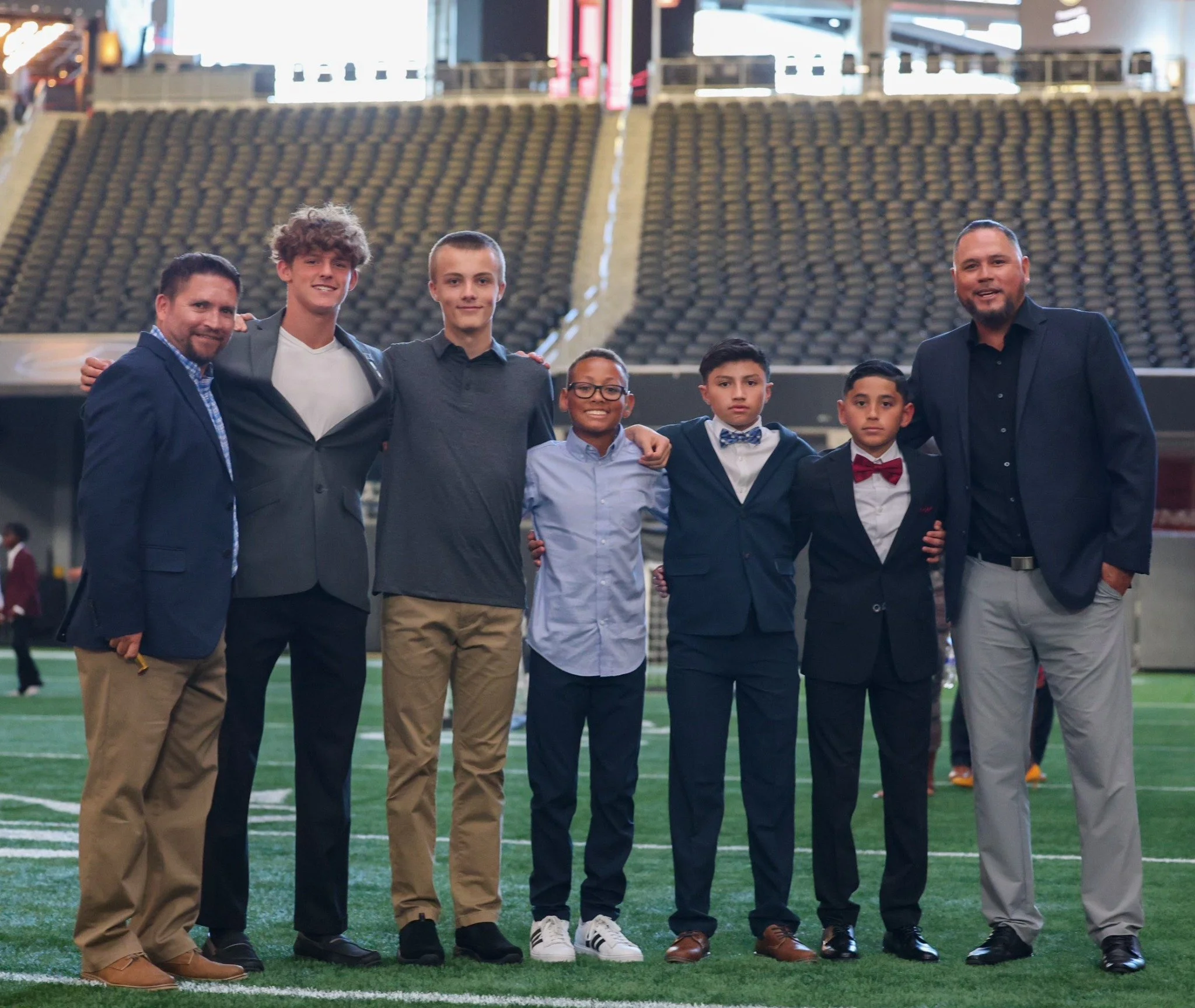 LSA players and adults together on a stadium field